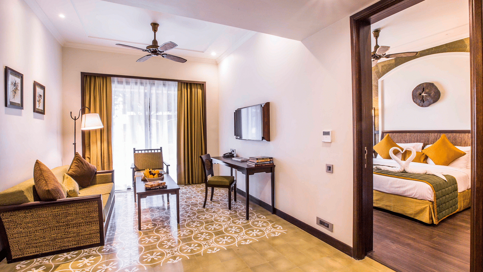 an image of a living room and a bedroom inside one of our rooms - Rhythm Lonavala