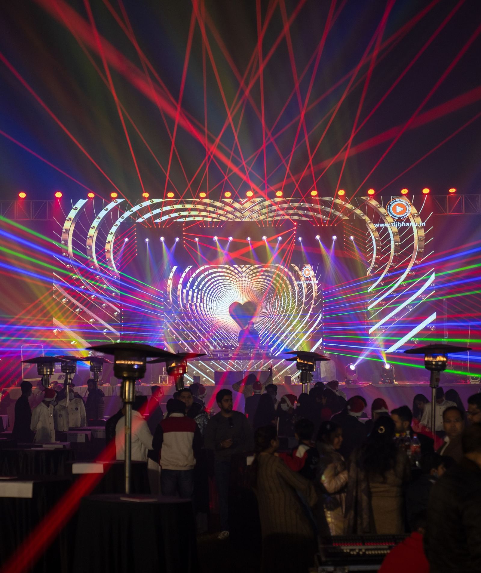 An event celebration with laser lights at Nirvana Luxury Hotel, Ludhiana.