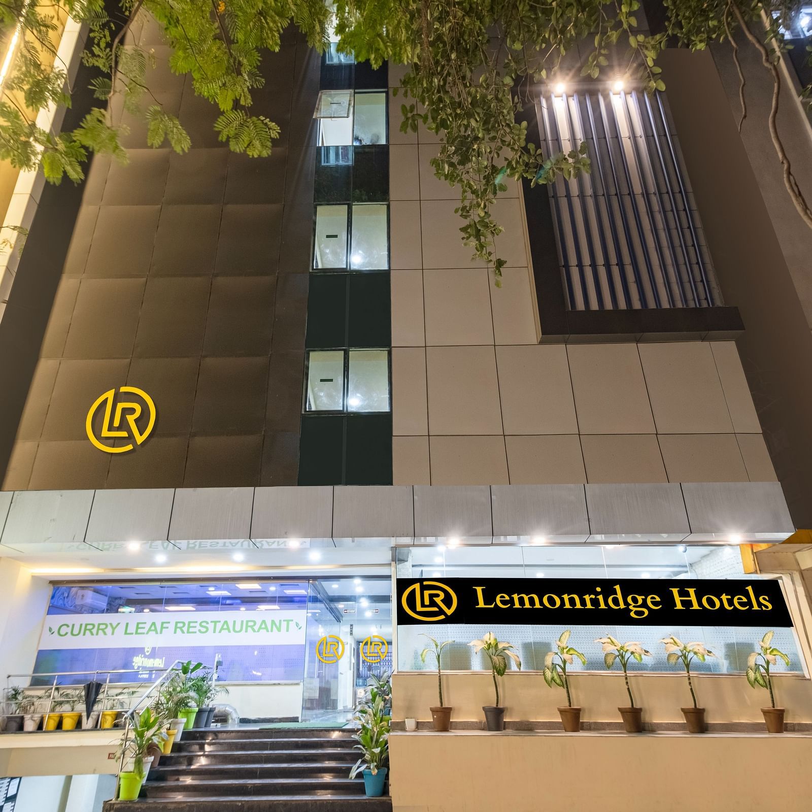 Nighttime view of the hotel's facade at Lemonridge Hotels.