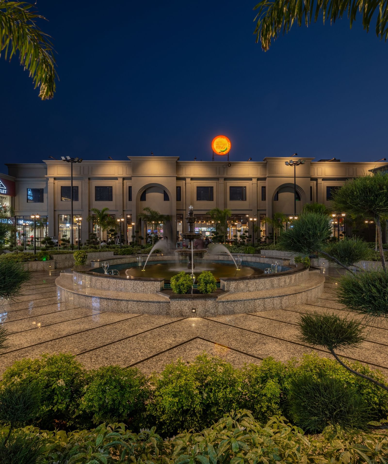 Night view of Hotel Highway King, Kishangarh illuminated with a garden area.