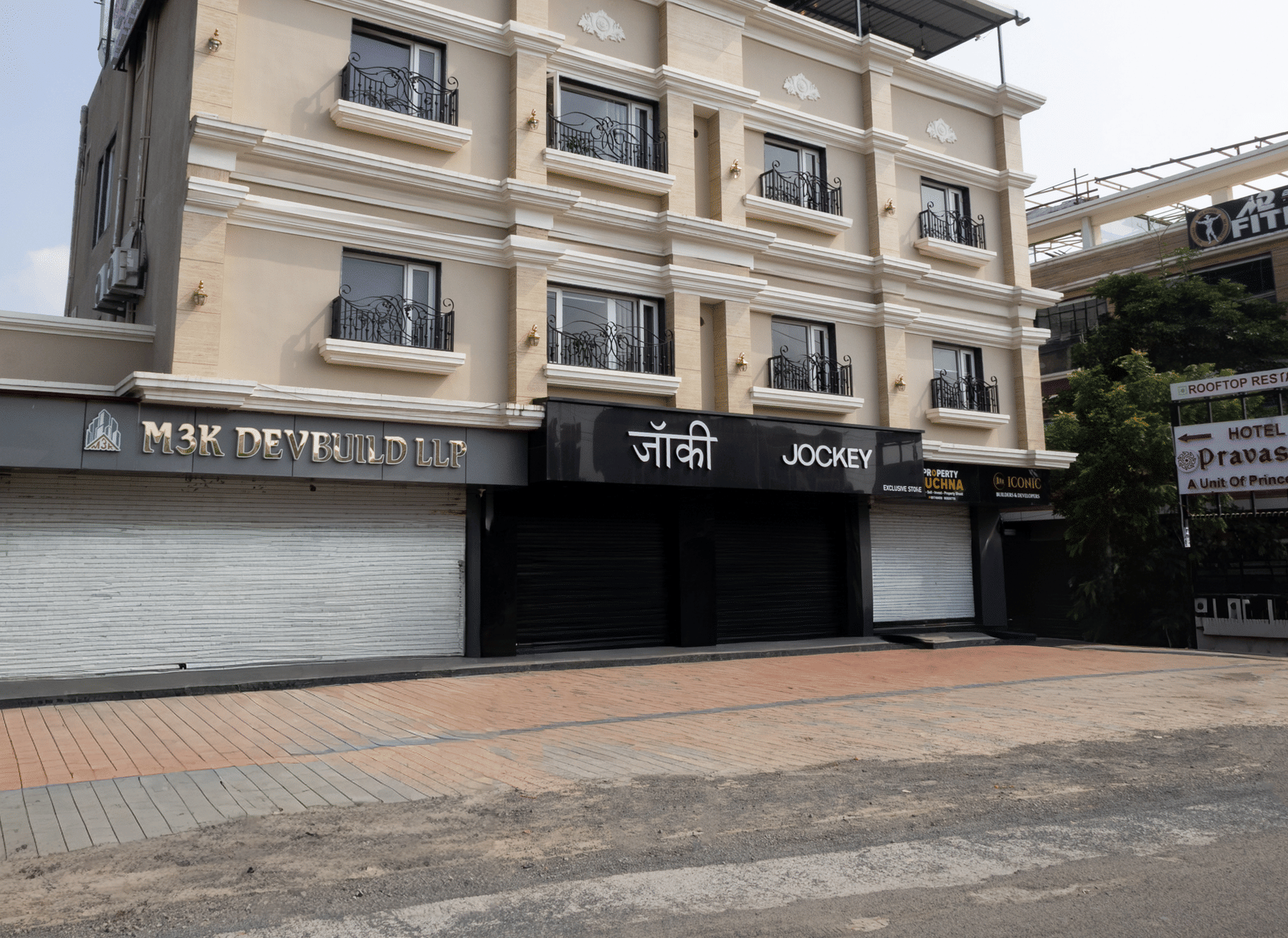 Exterior full view of the three-story building of Pravasa Stay Luv Kush, Indore.