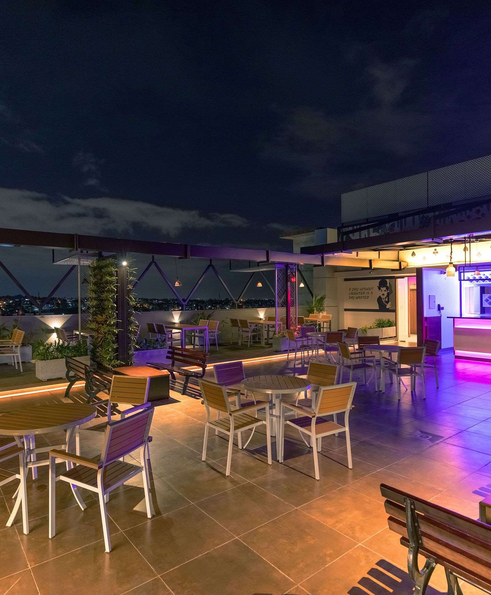 An image of a dining space with tables and chairs, complemented by an open roof at M Pro Palace.