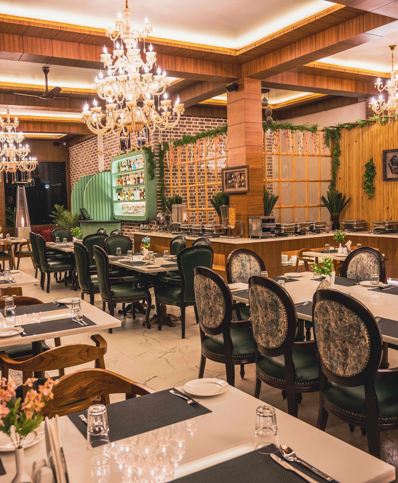 Alpenrose restaurant with well arranged dining area with elegant chairs - the tattva boutique resort