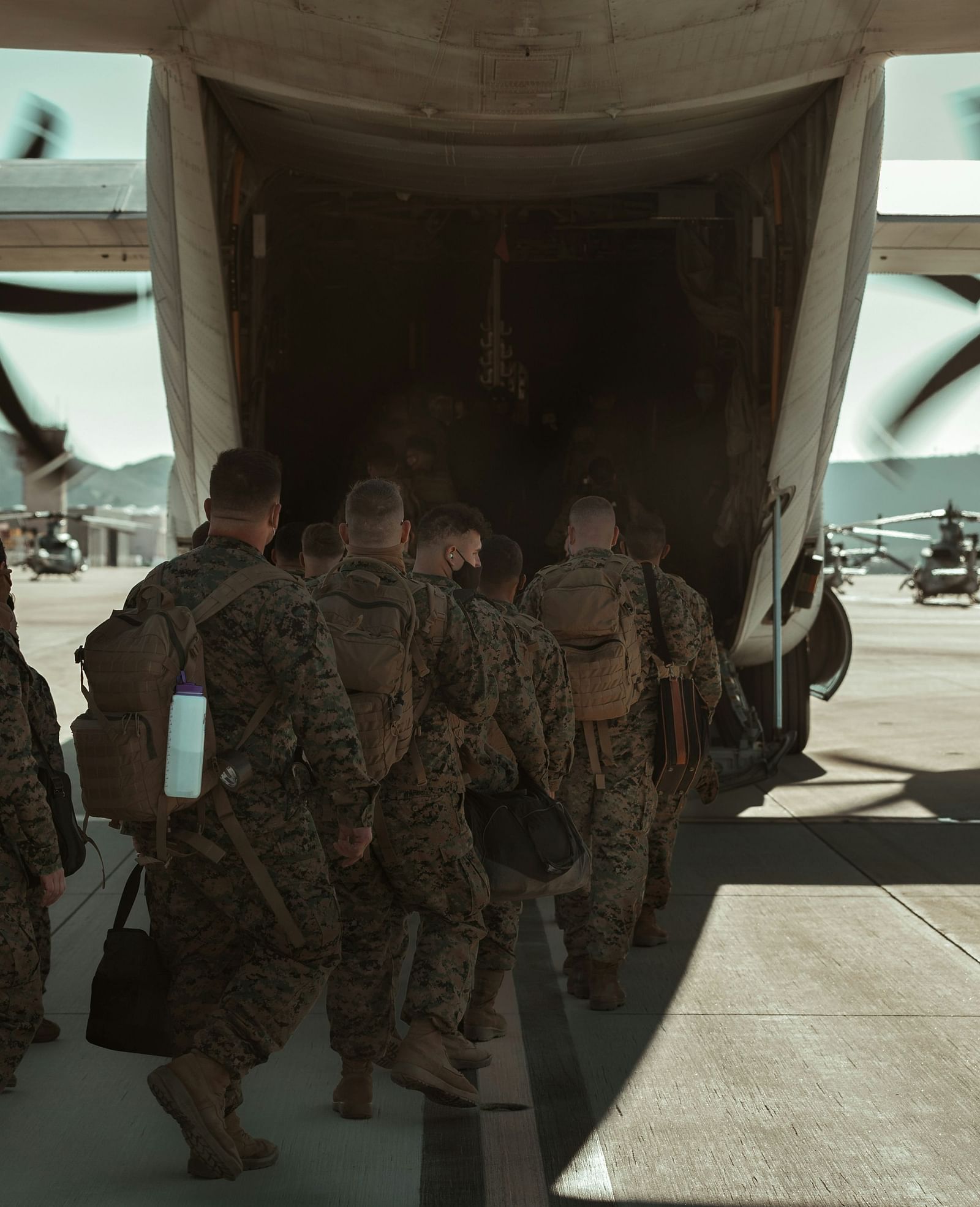 A group of soldiers entering a aircraft for a mission - Brewery Gulch Inn & Spa