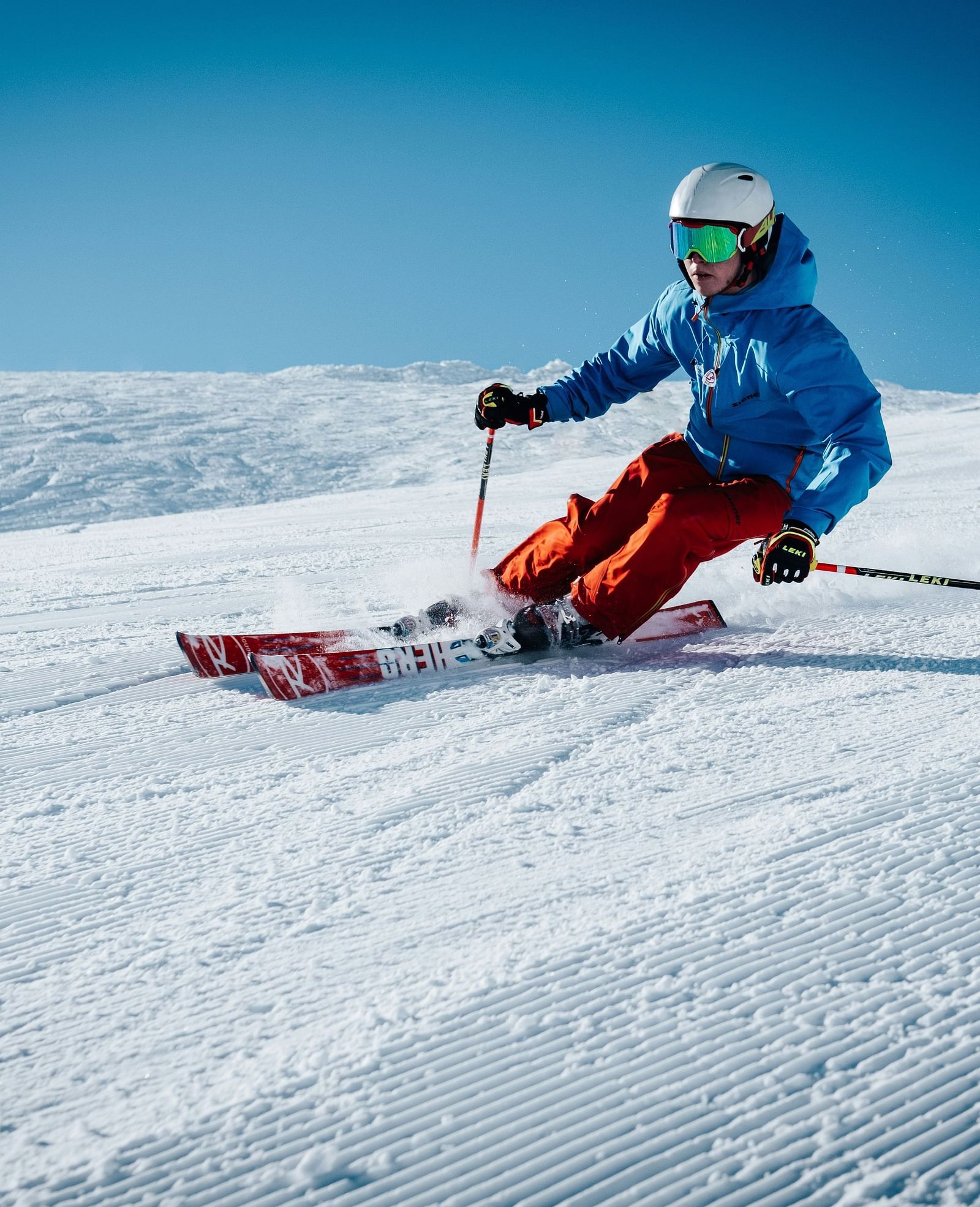 A person skiing down a snow-covered slope.