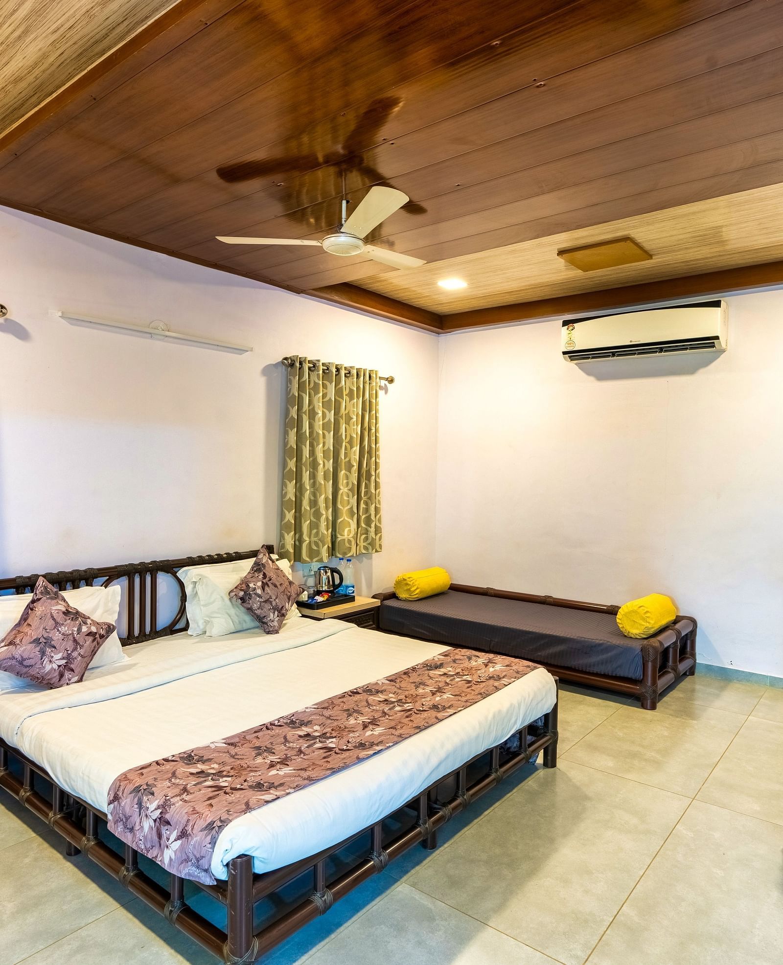 A room with with a double bed and seating arrangement at Saavaj Resort