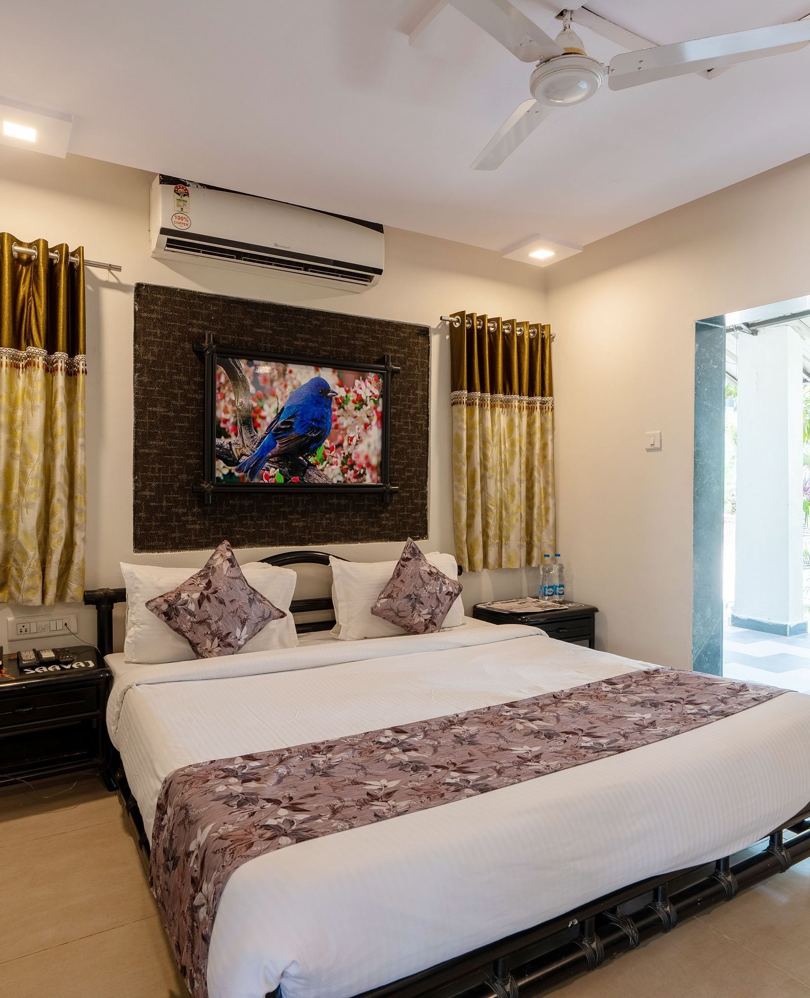 A room with with a double bed and side tables at Saavaj Resort