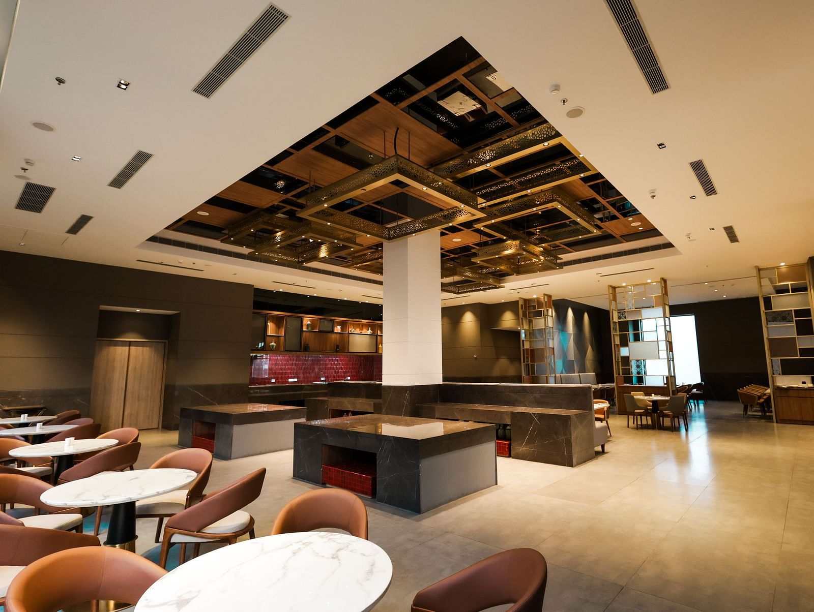Indoor restaurant with contemporary decor and comfortable seating at Ramada by Wyndham Sonipat Murthal