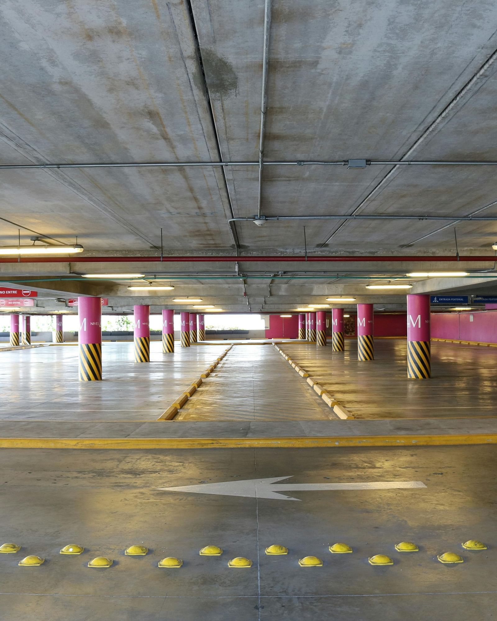image of an expansive parking space with arrows guiding the traveller 