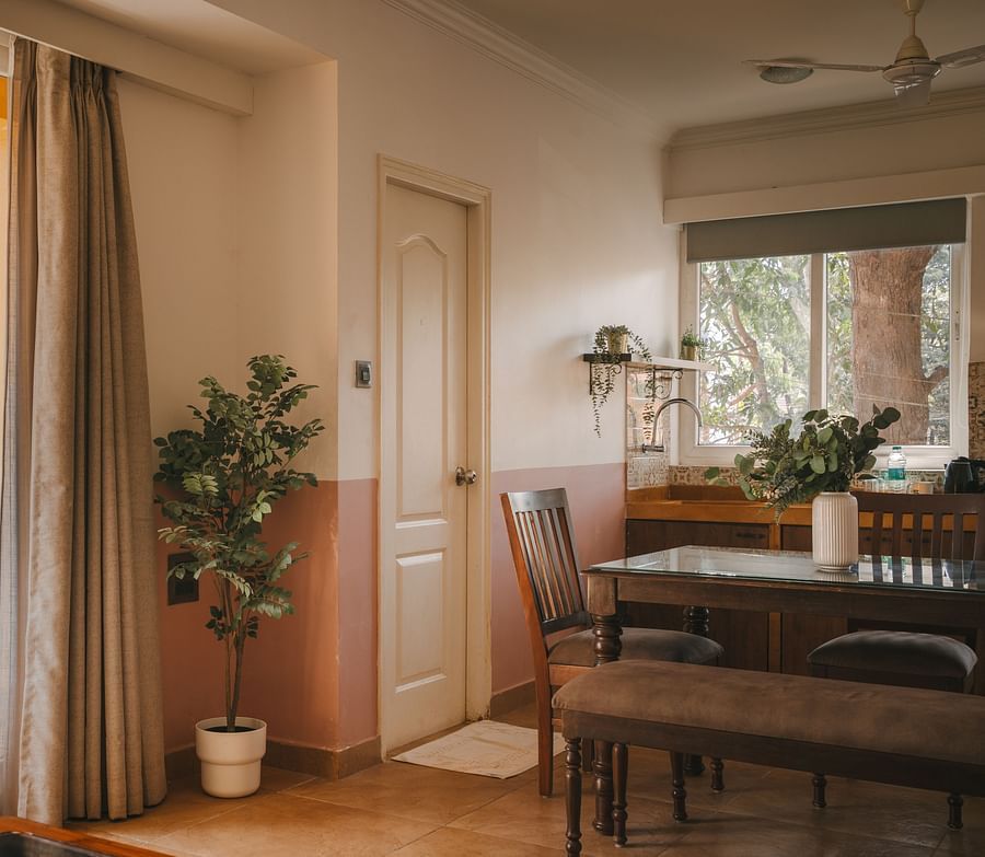 Spacious living area with a balcony view at One BHK Apartment, Richmonde Ananta Elite, Goa.