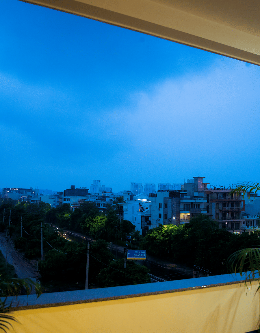 Evening view of the city from the balcony of the Standard Studio with Balcony at Lime Tree Luxury Studio