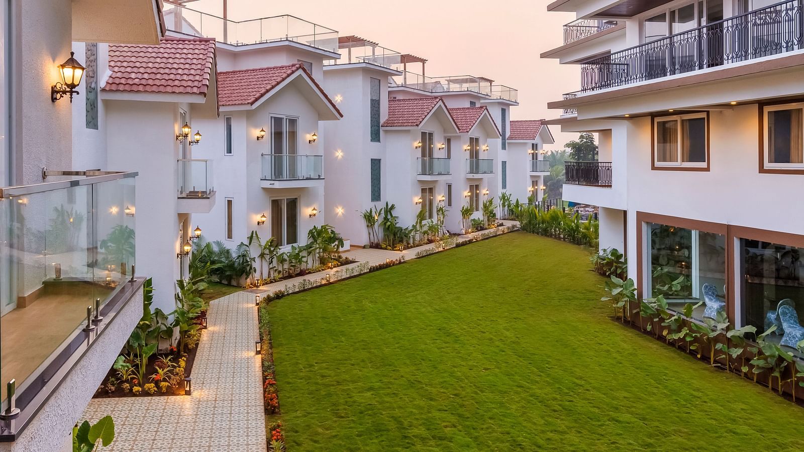 Rooms view with a manicured garden in front of it - The Tanisi Hotels & Resorts, Goa