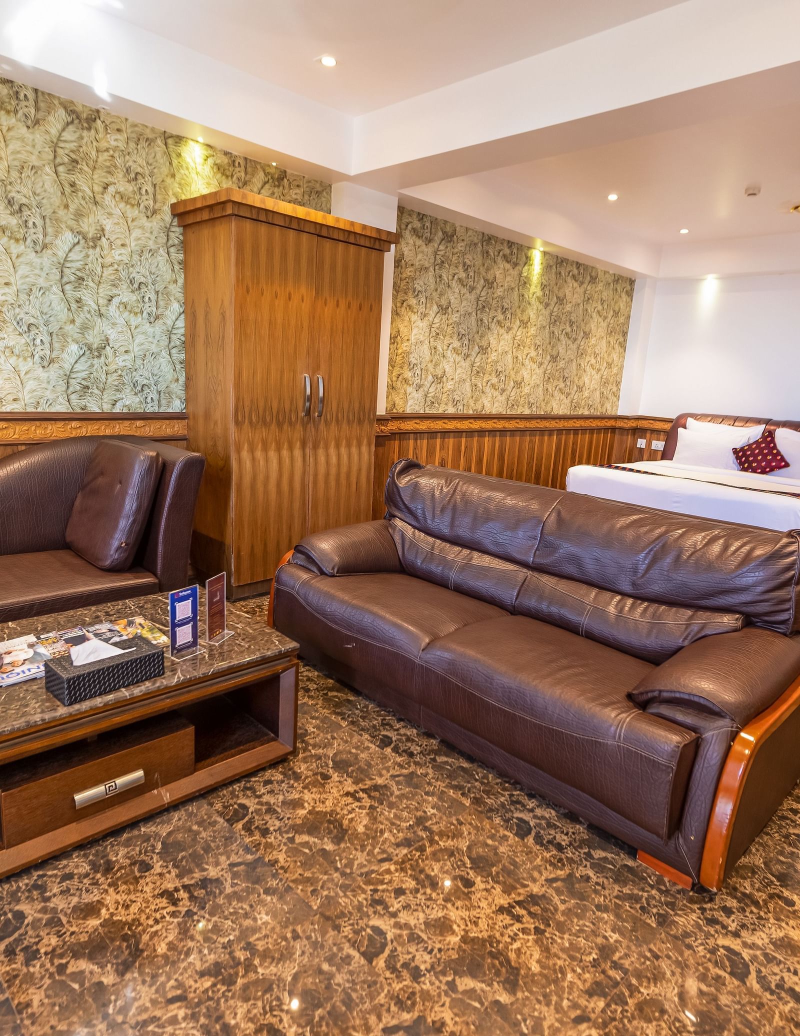 Two large sofas and a king size bed Inside the 90 Degree Club Suite at Parakkat Nature Hotel Resort Munnar 2