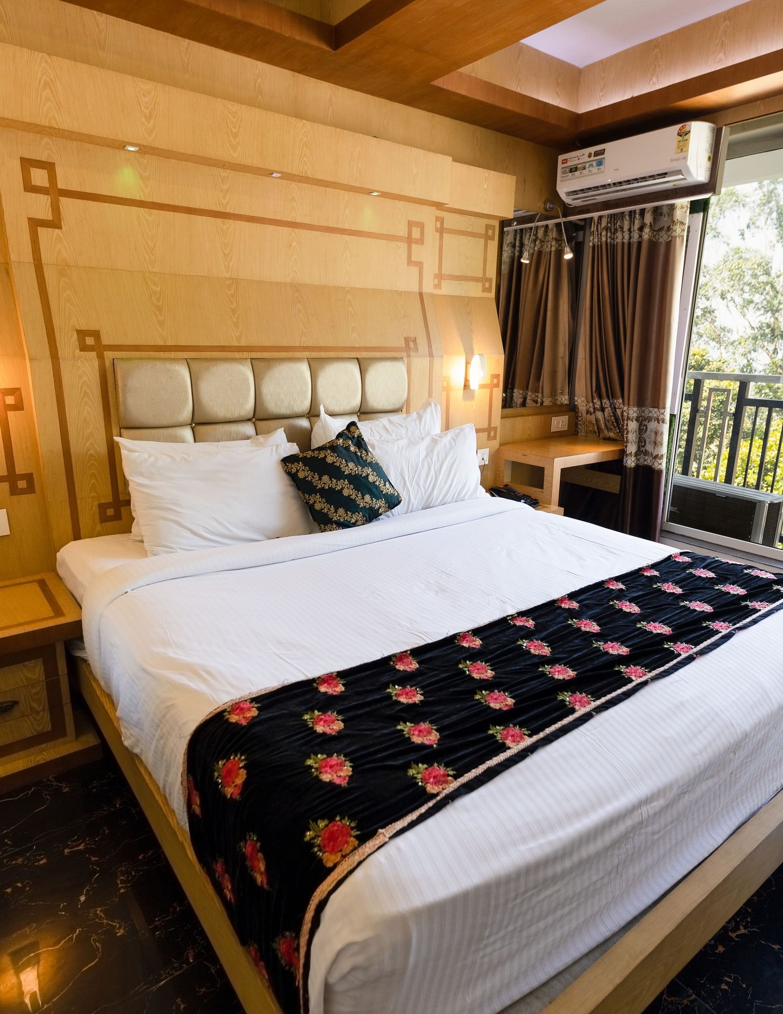 Wide view of the double bed in the Superior Room at Parakkat Nature Hotel and Resorts Munnar 1