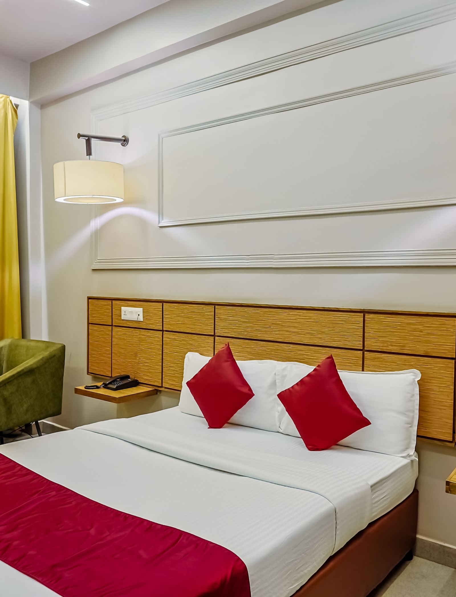 Comfortable twin bedded room with bright decor at Max Hotel Prayagraj.