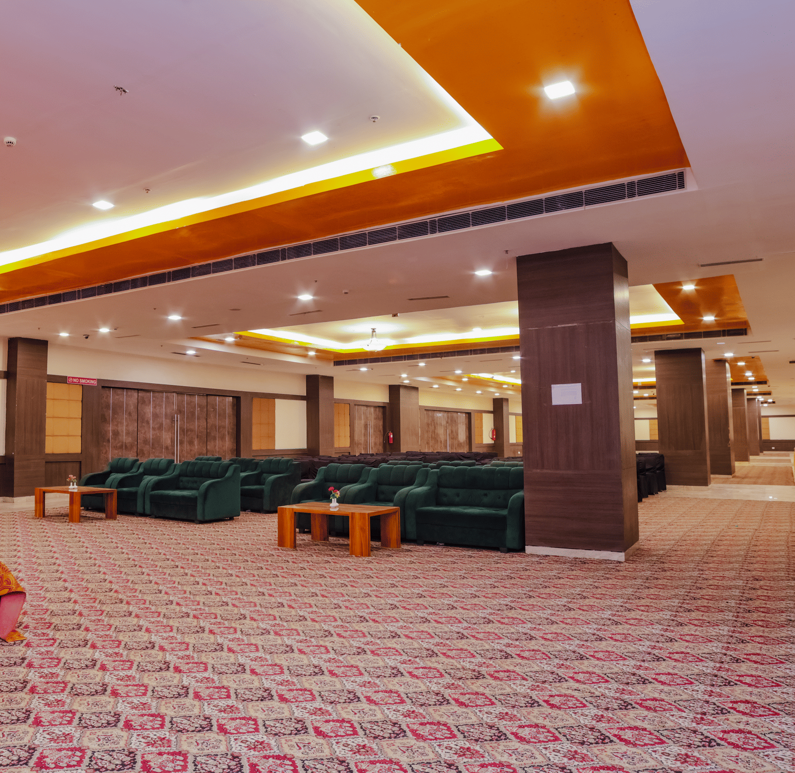 A large event space with seating areas and ample room for guests - Hyphen Grand, Haridwar