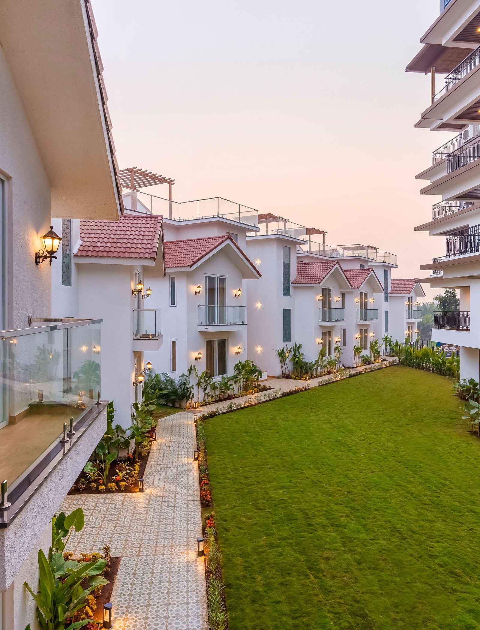 Rooms view with a manicured garden in front of it - The Tanisi Hotels & Resorts, Goa