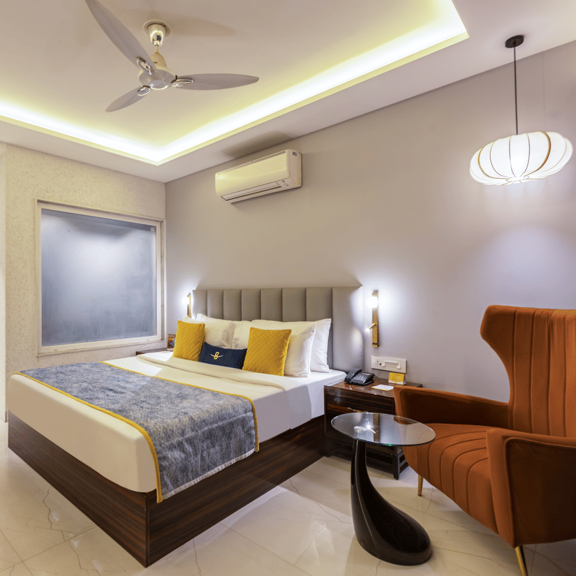 Room interior with contemporary design, warm lighting, and balanced color palette highlighting comfort and elegance -  Hotel Bawa, Gurgaon