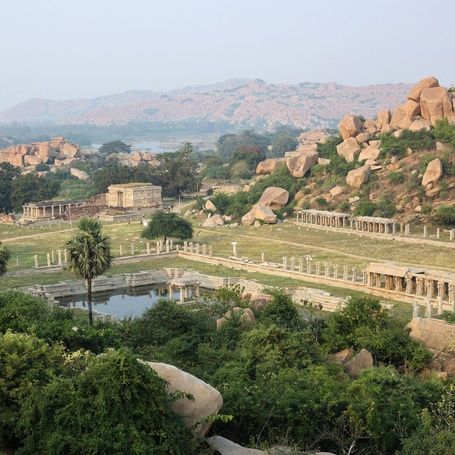 Hampi ancient ruins with temples and rocky hills.