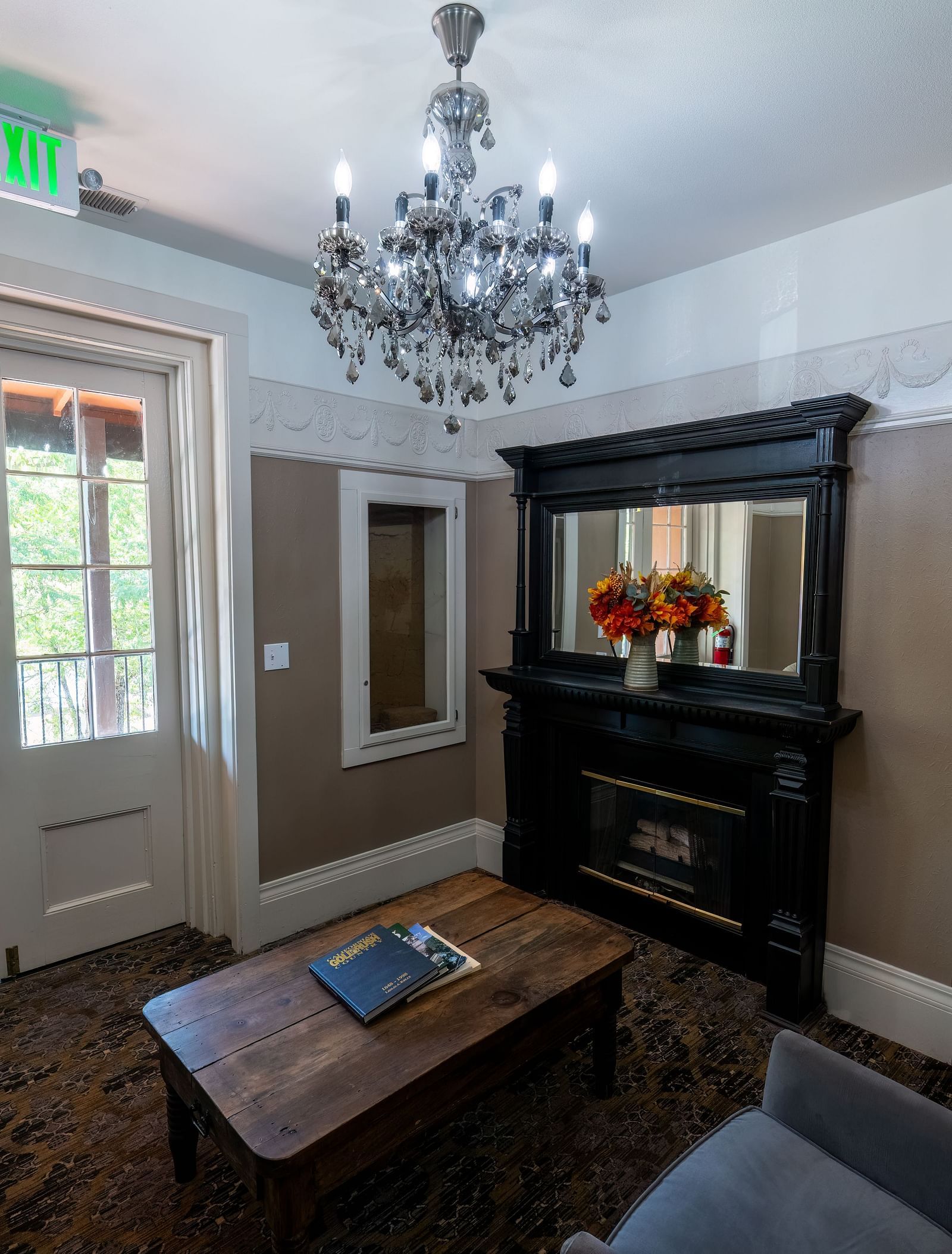 Elegant guest room with classic furnishings and natural light at The Groveland Hotel.