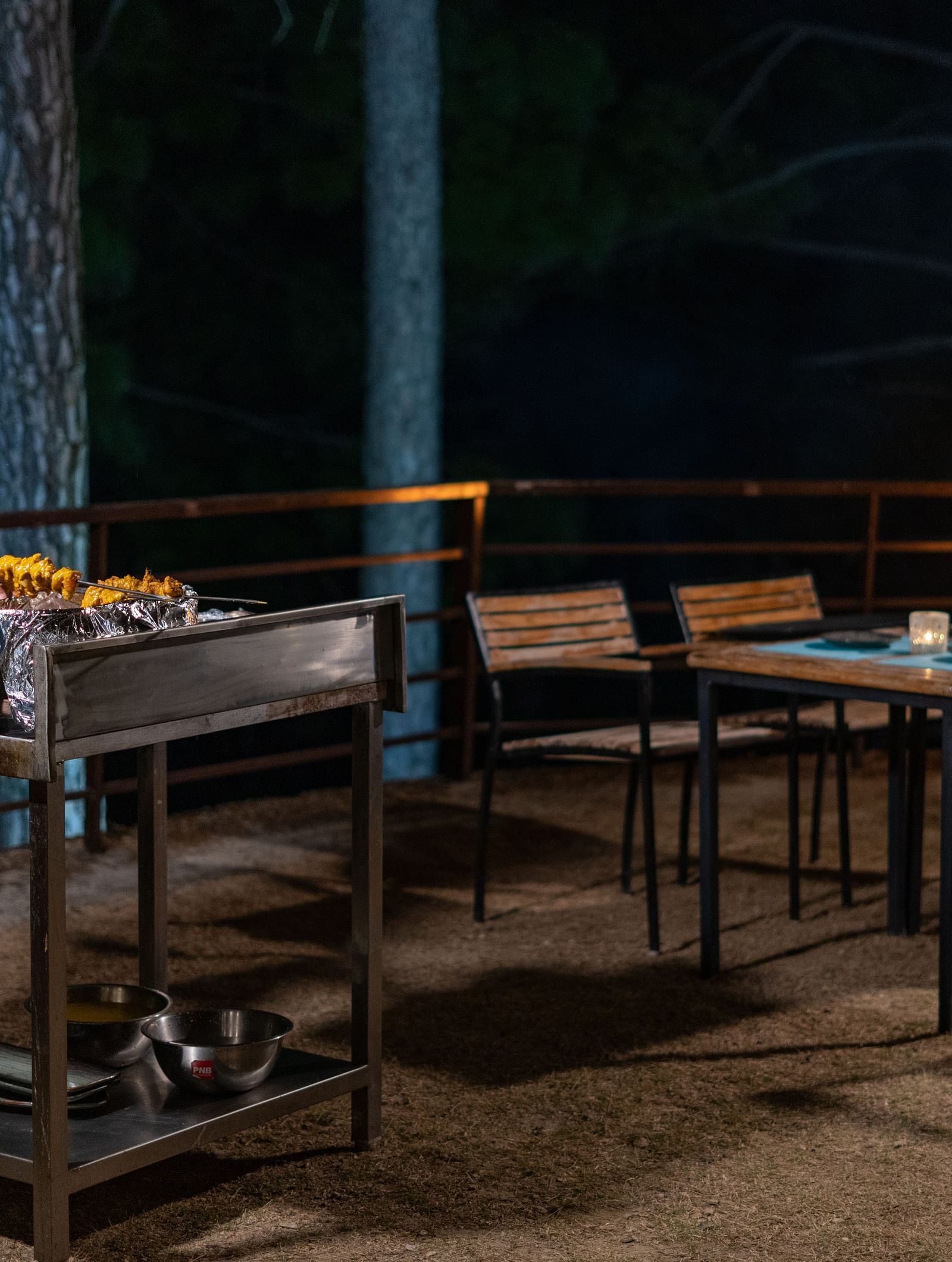 Chef performing a live barbecue session in the garden at BluSalzz Escapade Resort, Lansdowne.