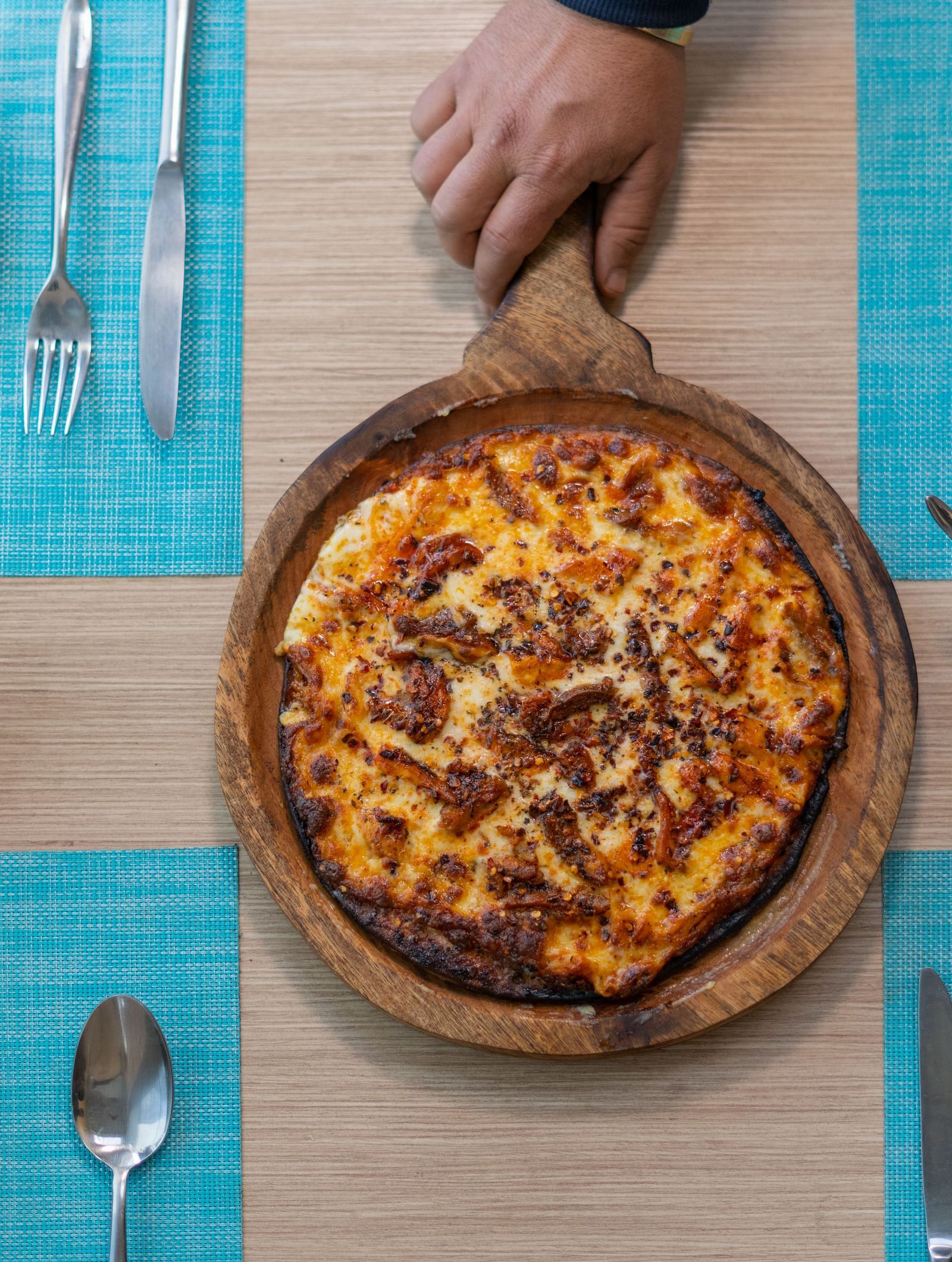 A fresh pizza served hot with toppings at BluSalzz Escapade Resort, Lansdowne.
