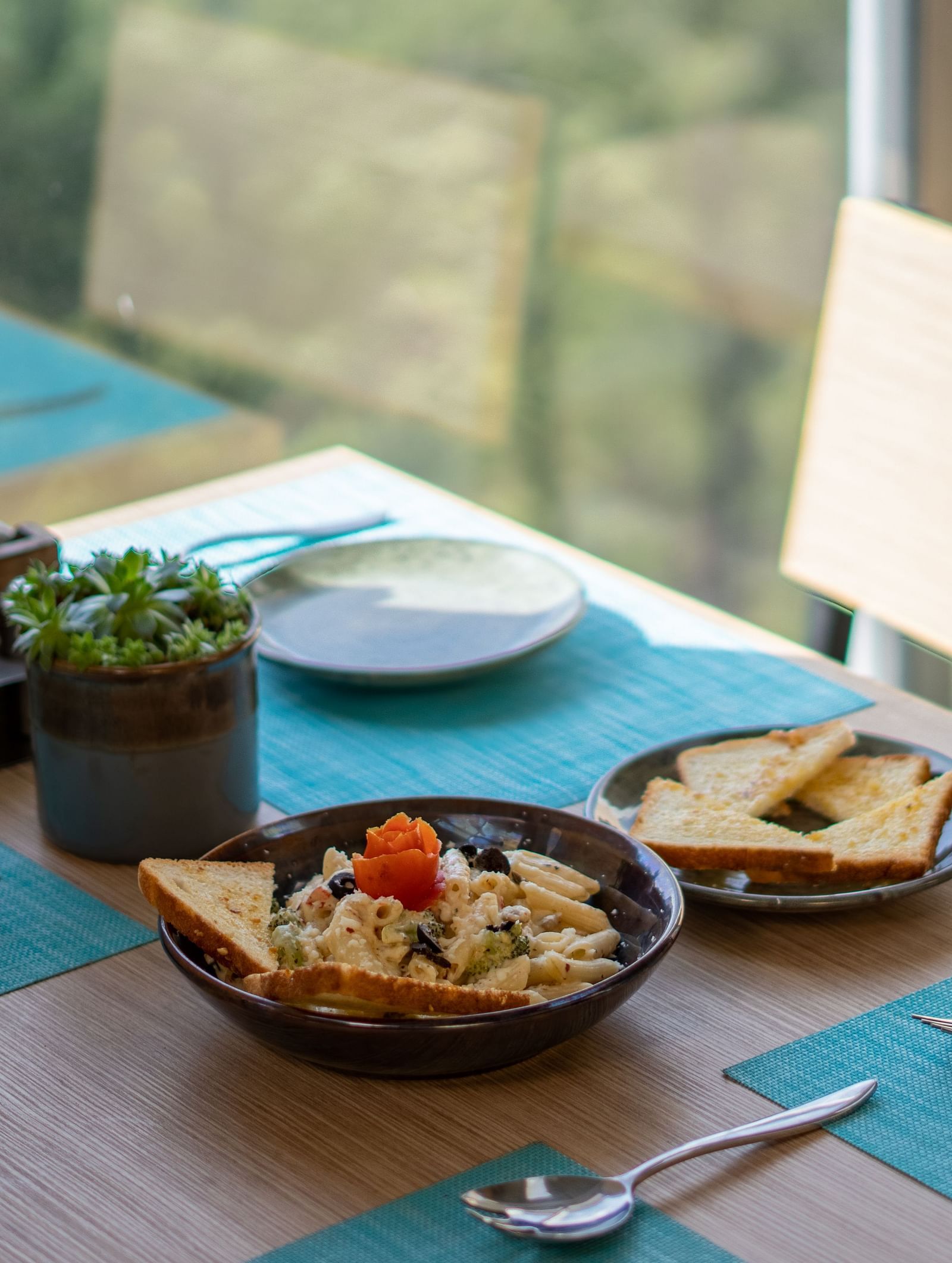 A dish placed on a table with cutlery arranged beside it at BluSalzz Escapade Resort, Lansdowne