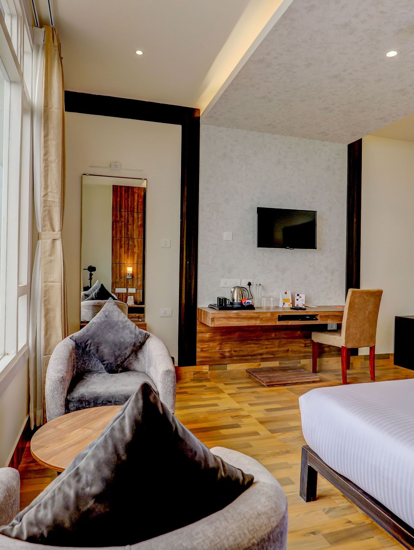 view of king size bed and TV of a Deluxe Room Banari Regency by Summit, Namchi