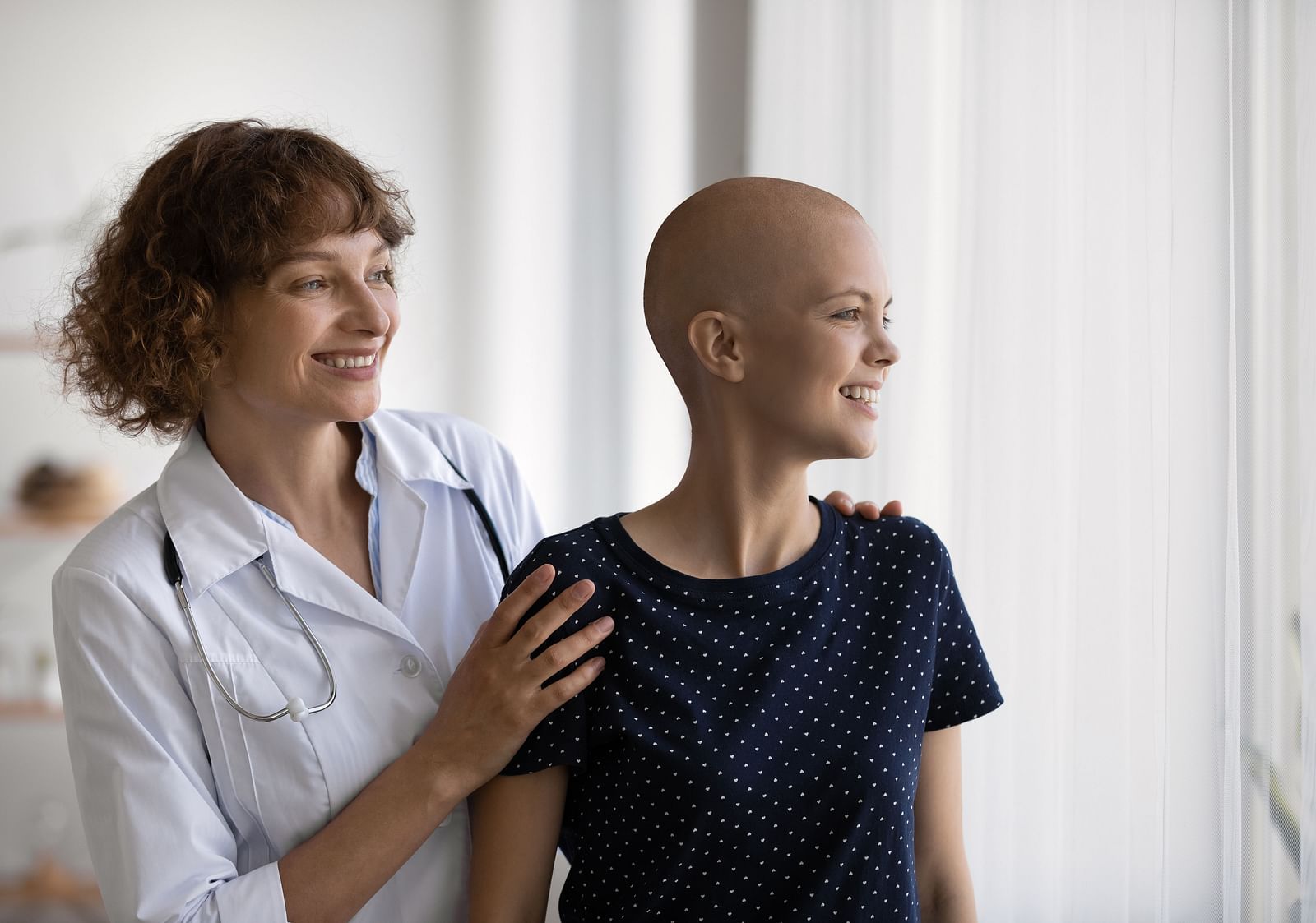 A woman receiving care from a nurse for Metastatic Disorder - Shreyas Retreat