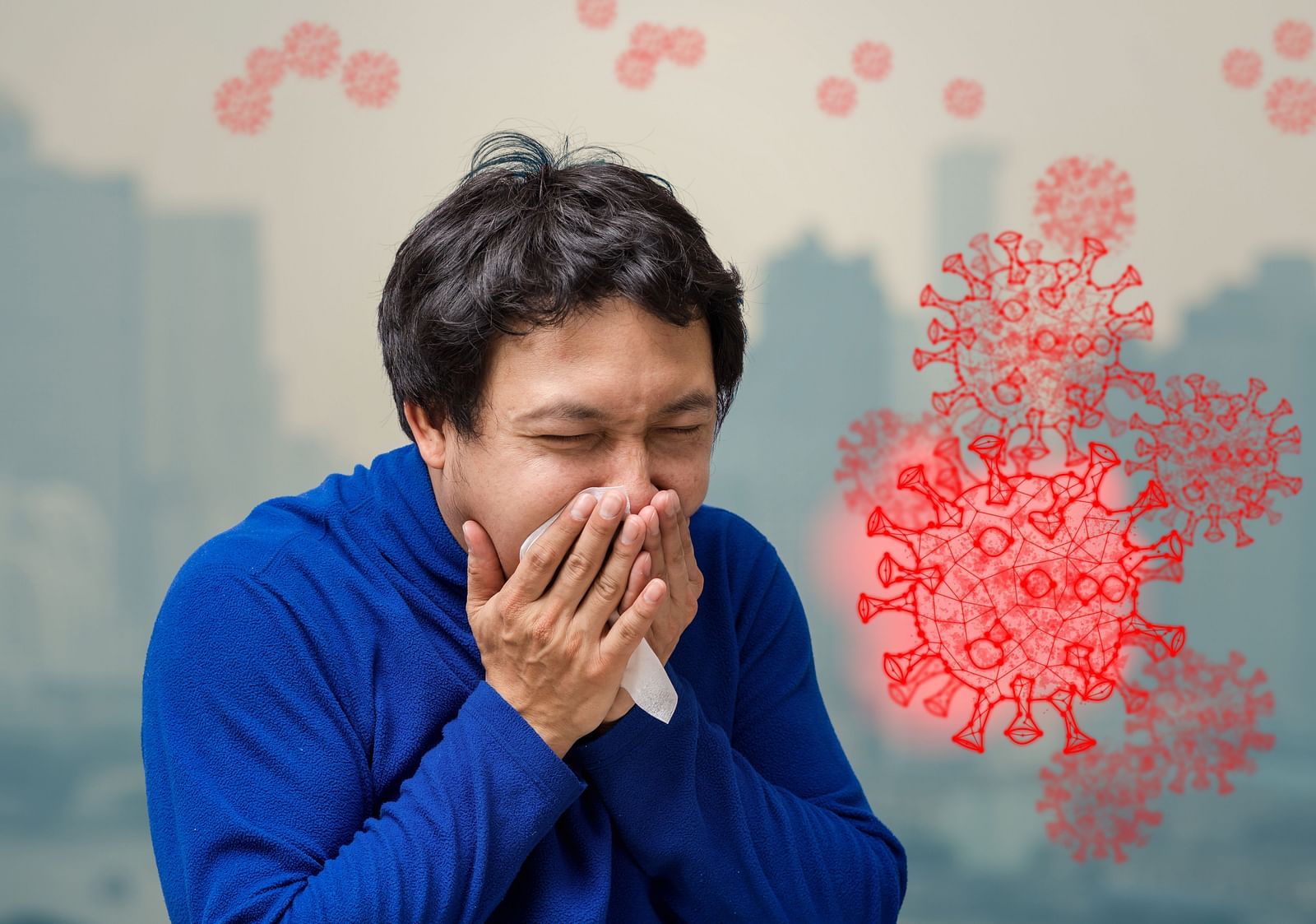 A man coughing with visible air pollution in the background - Shreyas Retreat