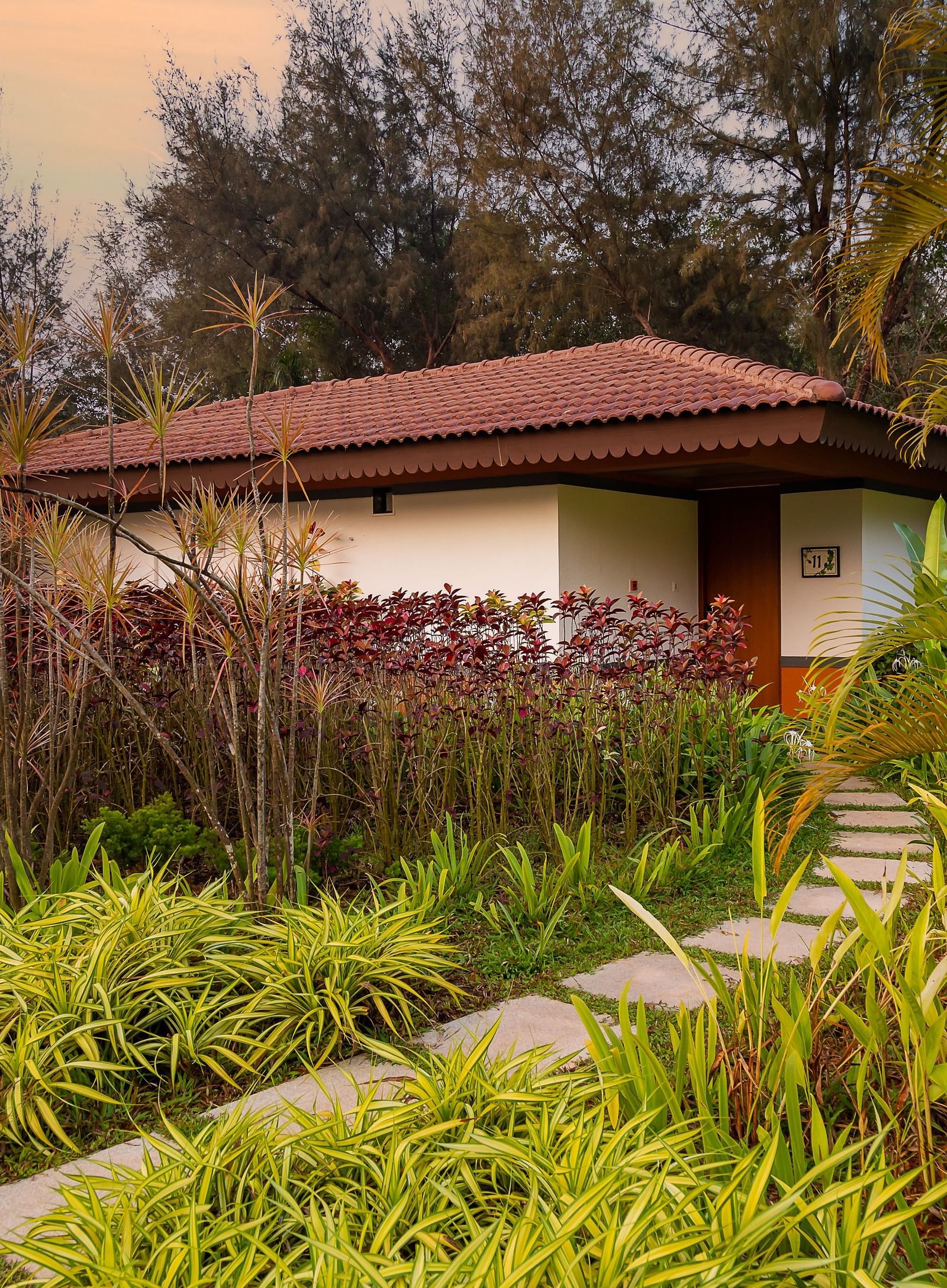 An far out view of the Villa with various trees and plants around it - Gamyam Retreat