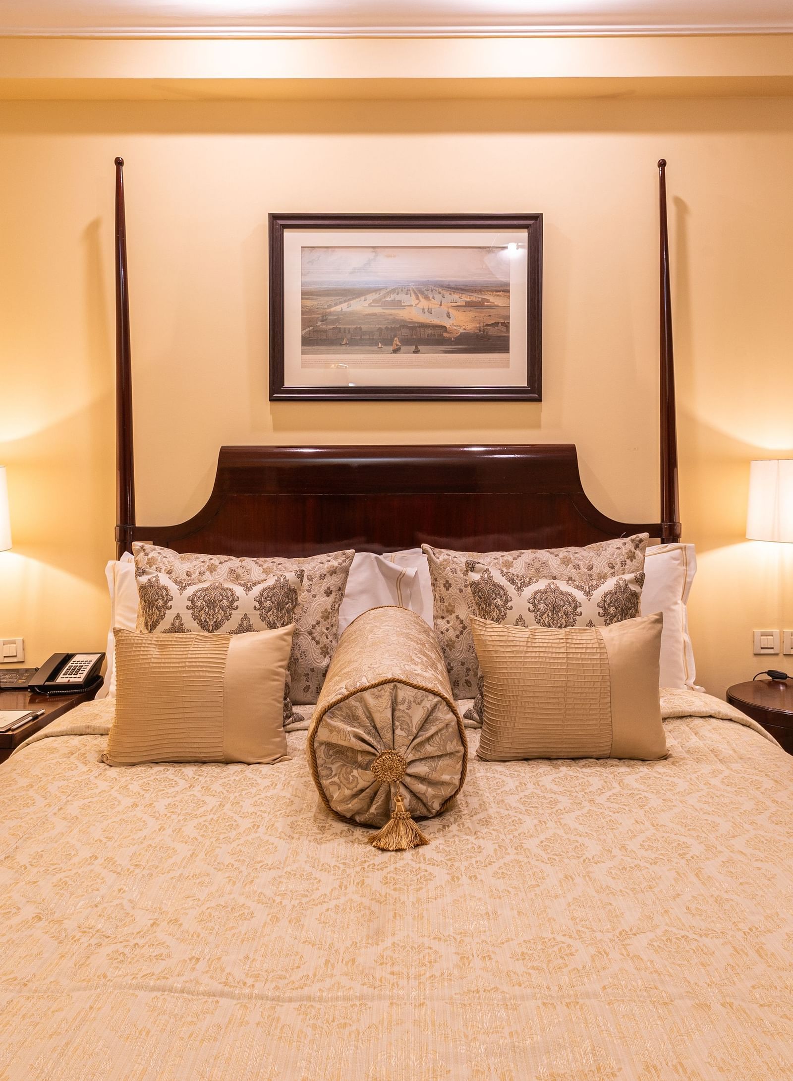 image of a king size bed with table lamps at both sides of the bed at heritage parlour rooms - The Claridges New Delhi