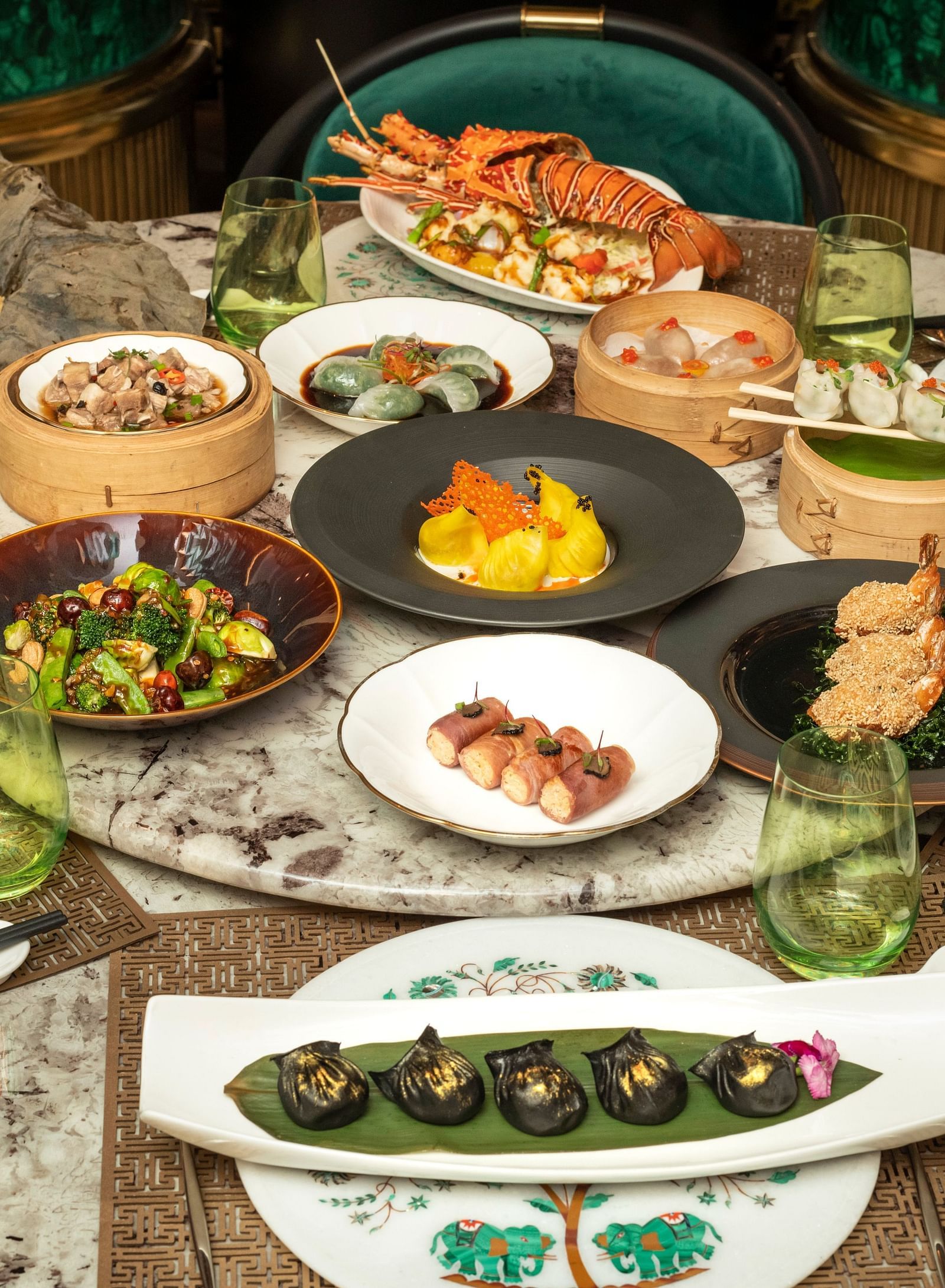 A wide array of dishes on a table at The Claridges New Delhi