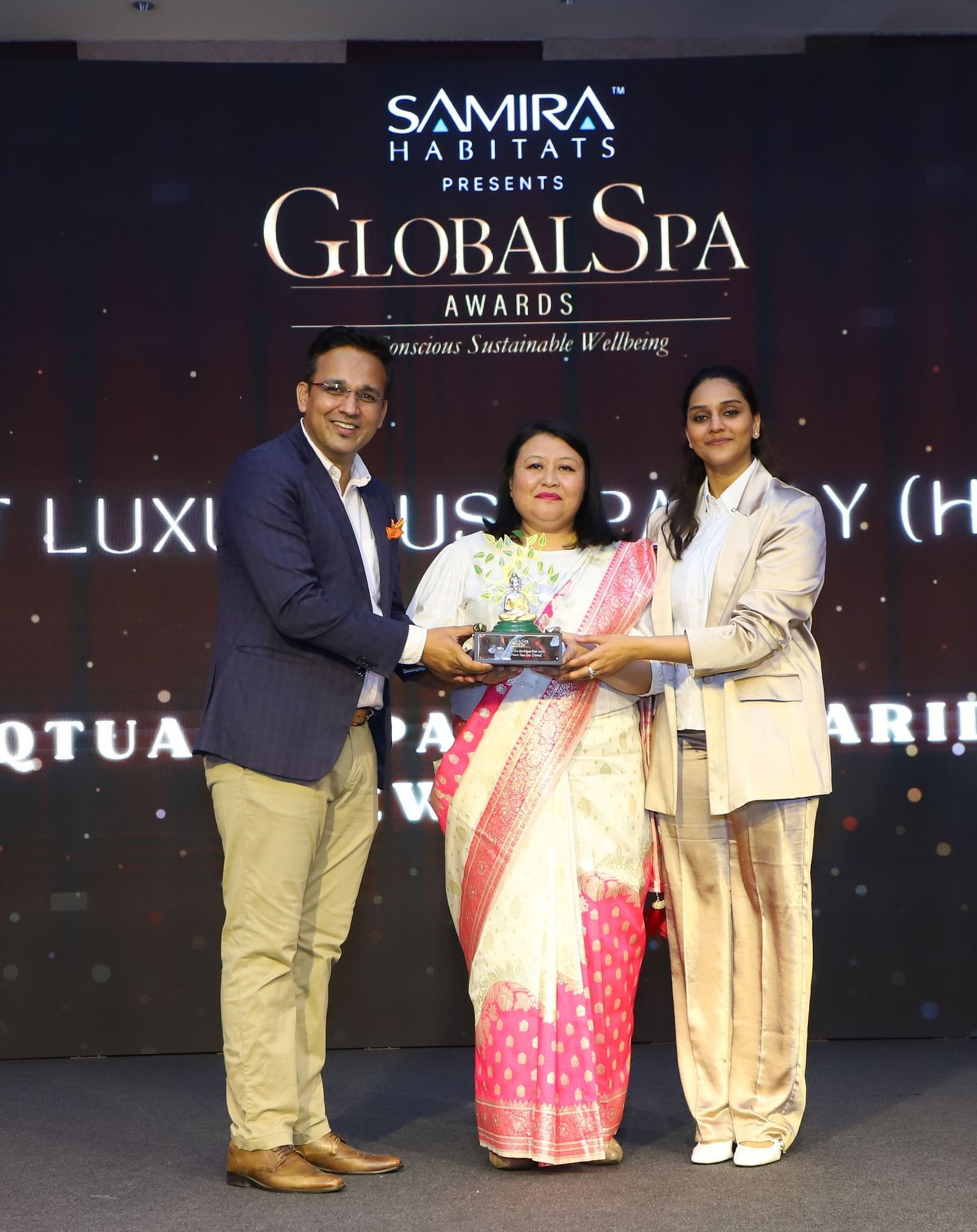 Team from Claridges Collection receiving an award at the Global Spa Awards