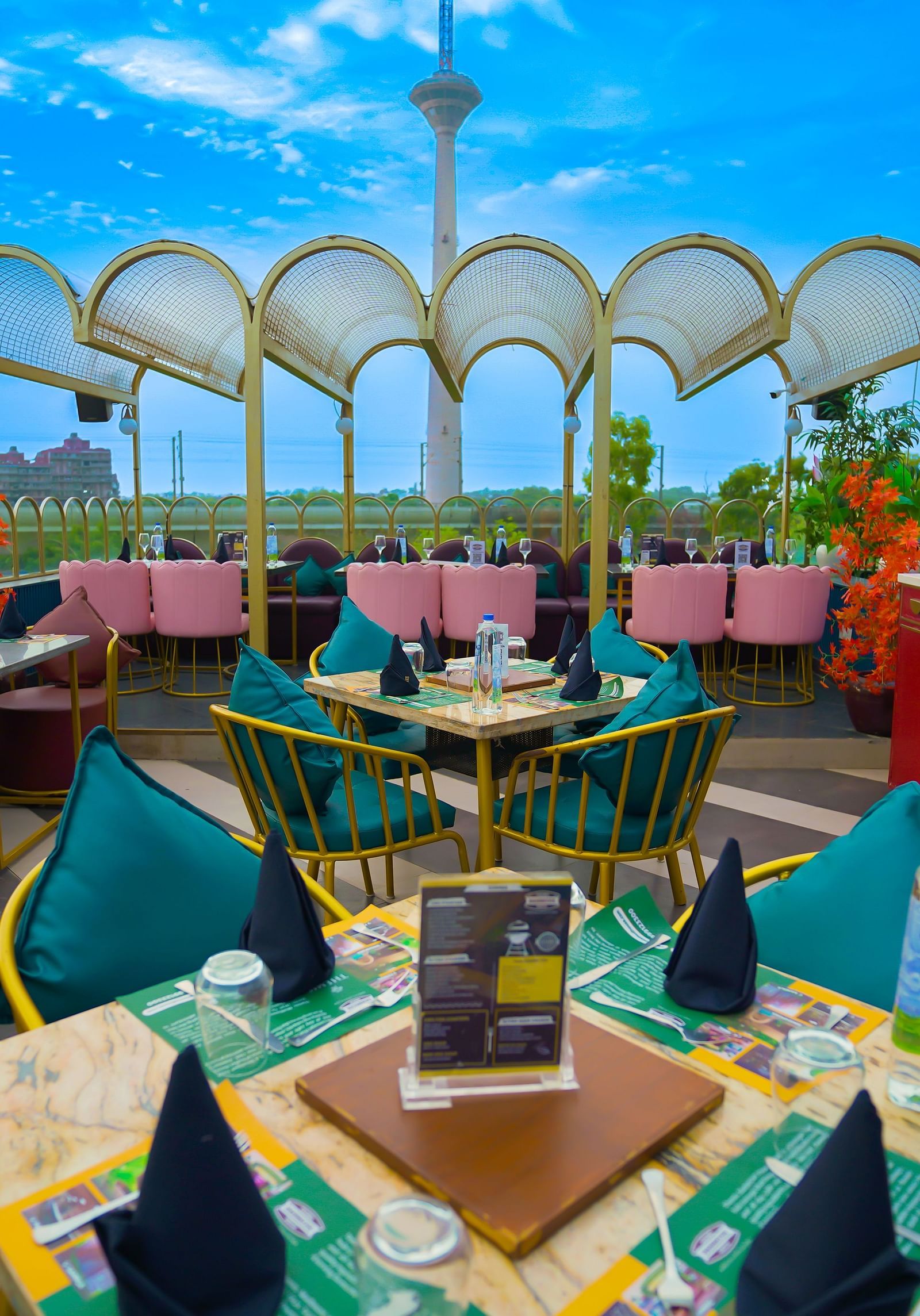 An image of a seating area featuring a four chairs and a table set at the terrace of Themis Barbecue House