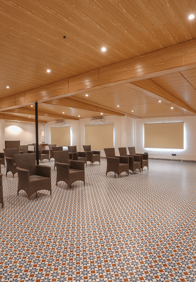 An image of a expansive banquet hall with a podium and seating arrangement.