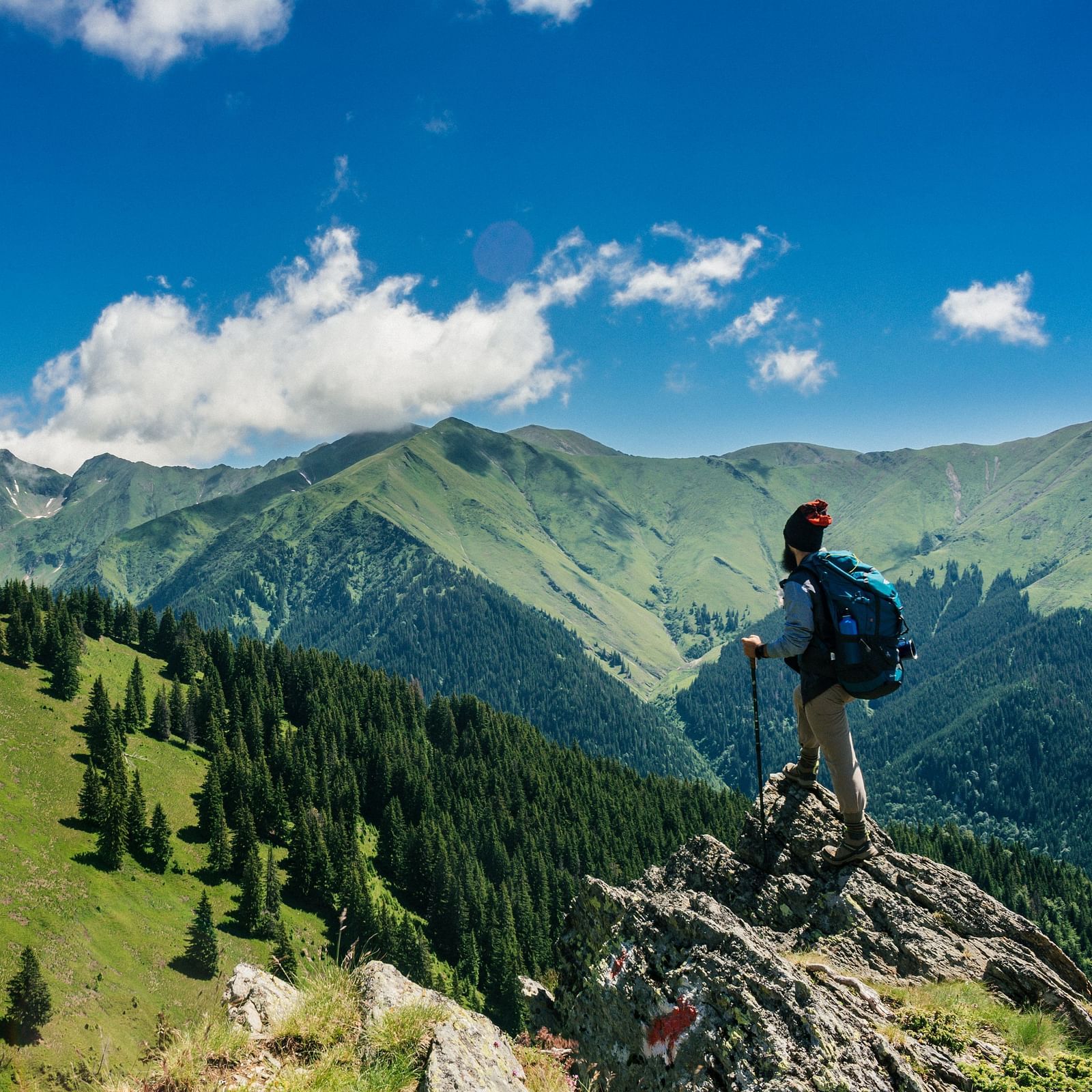 A person standing at the edge of a cliff