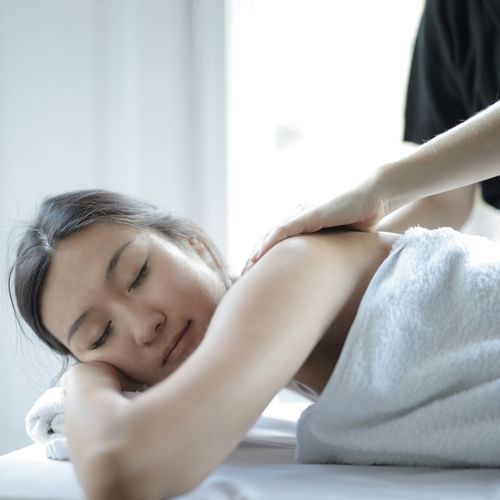a shot of a lady taking spa treatments