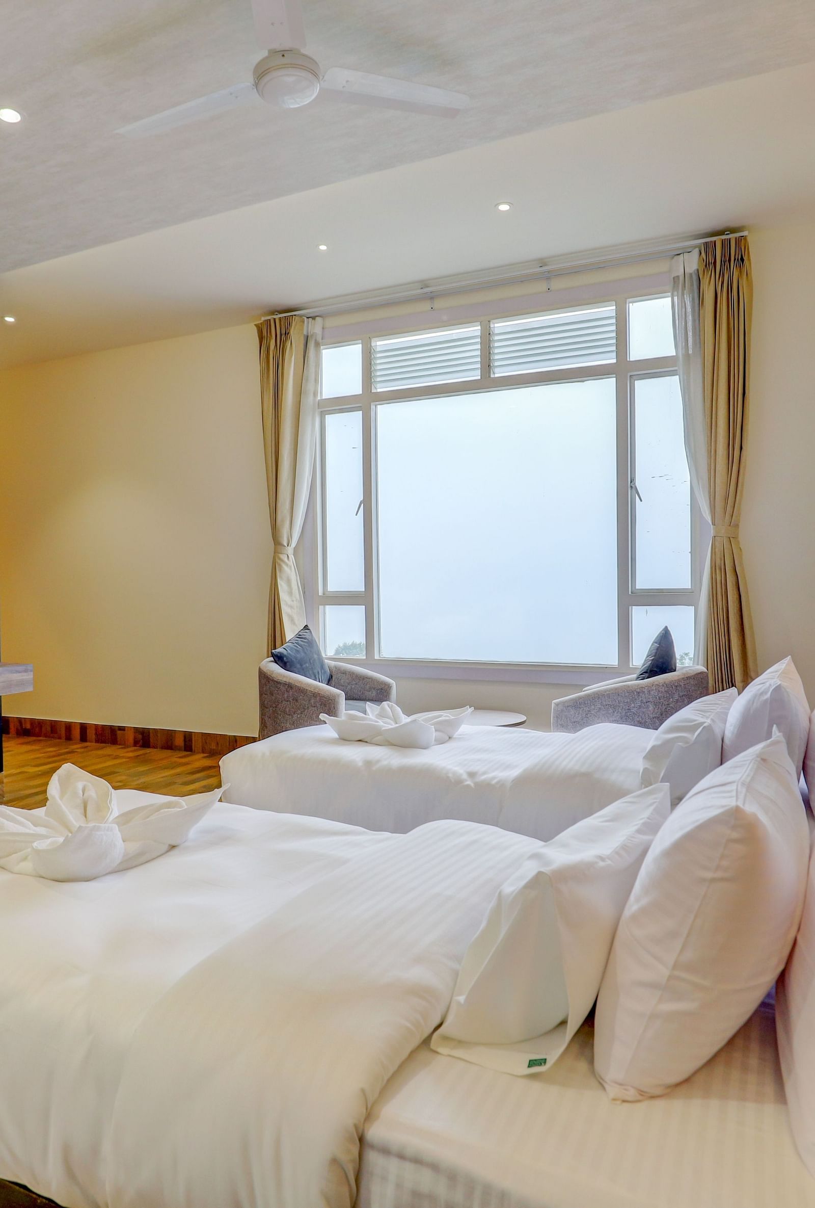 view of twin beds and TV of a Premium Room at Banari Regency by Summit, Namchi