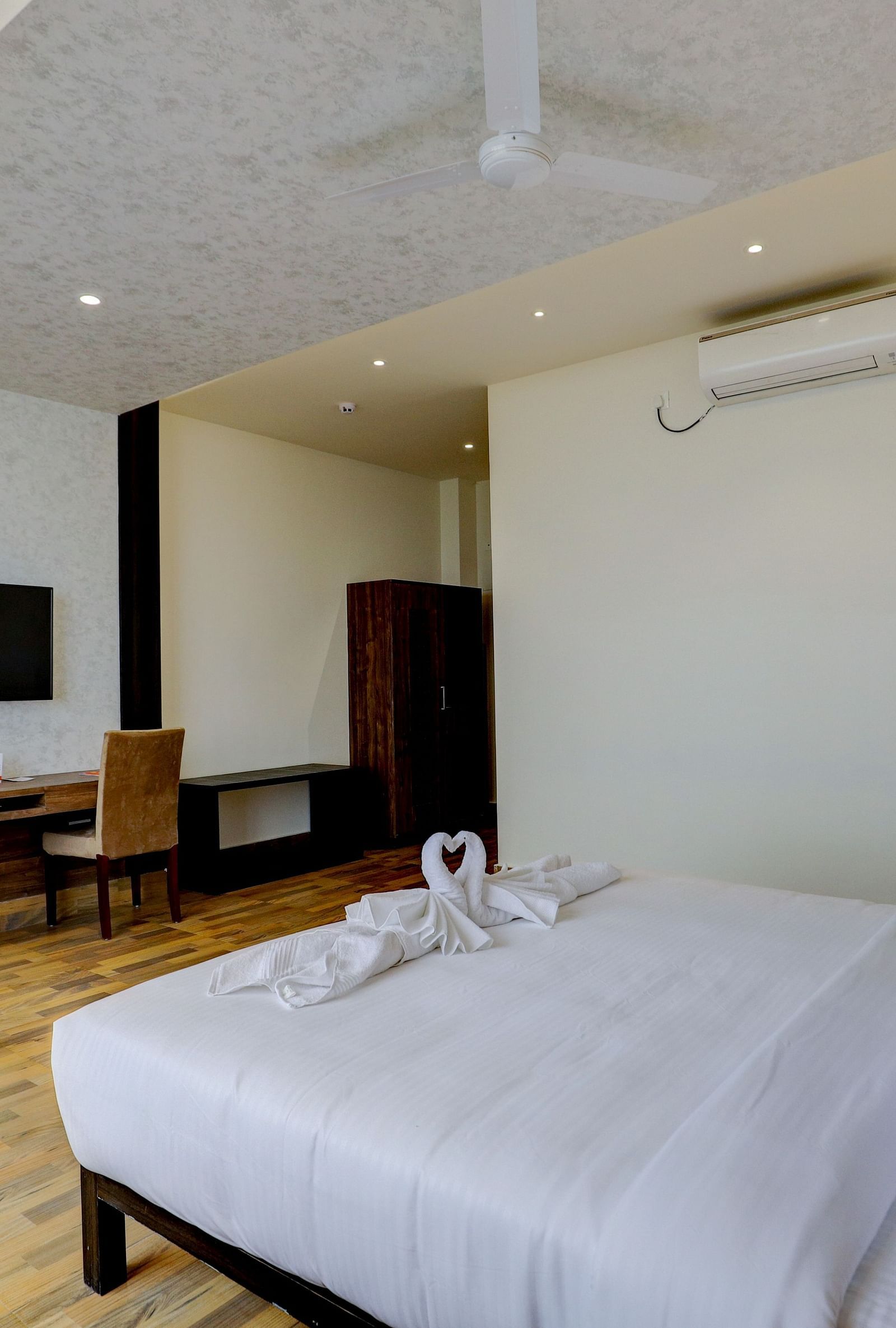 view of a king size bed of a Suite at Banari Regency by Summit, Namchi