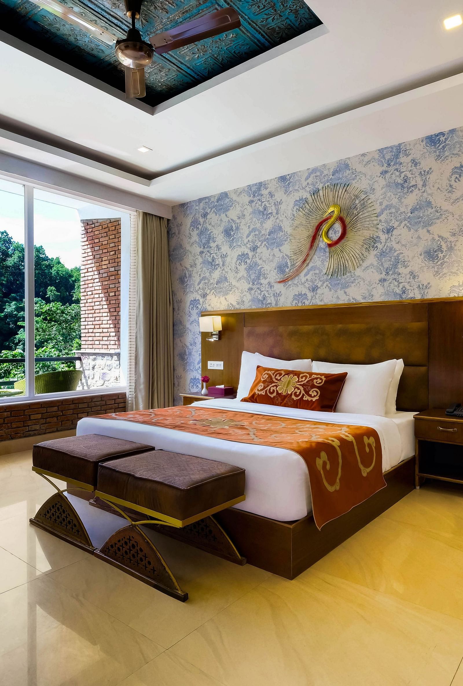 Side view of a room with bed and sitting area at Summit By The Ganges Beach Resort & Spa, Rishikesh