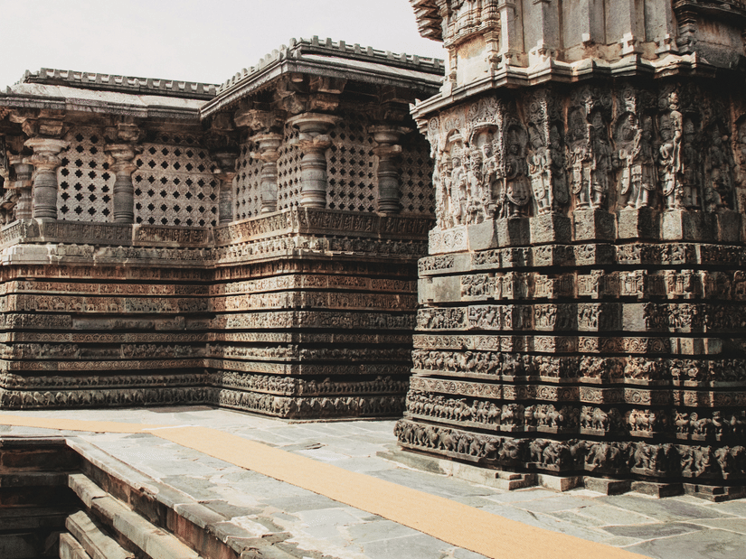An ancient stone temple showcasing intricate carvings, remarkable craftsmanship, and timeless architectural heritage.