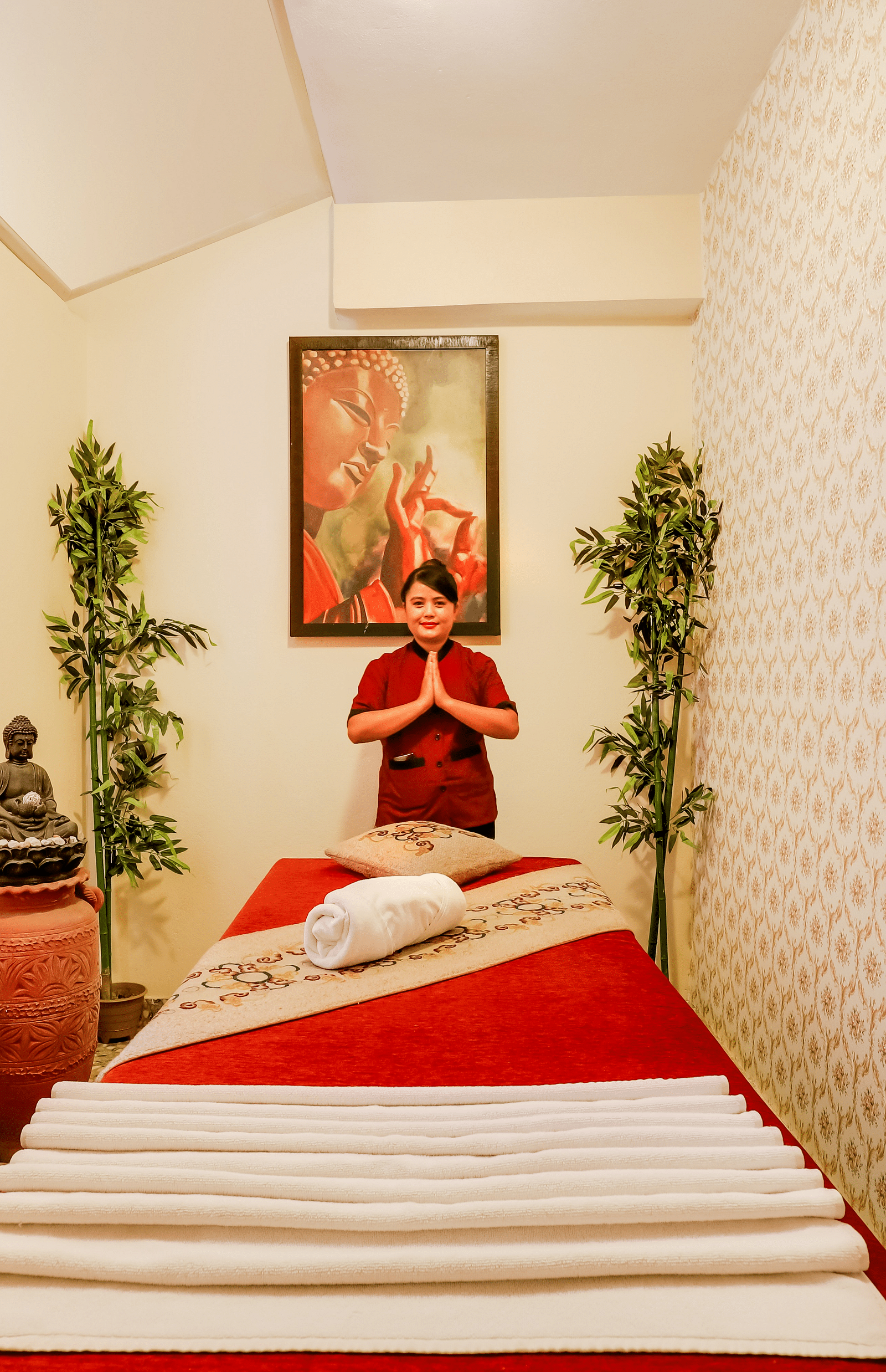 a massage therapist welcoming guests to metta spa