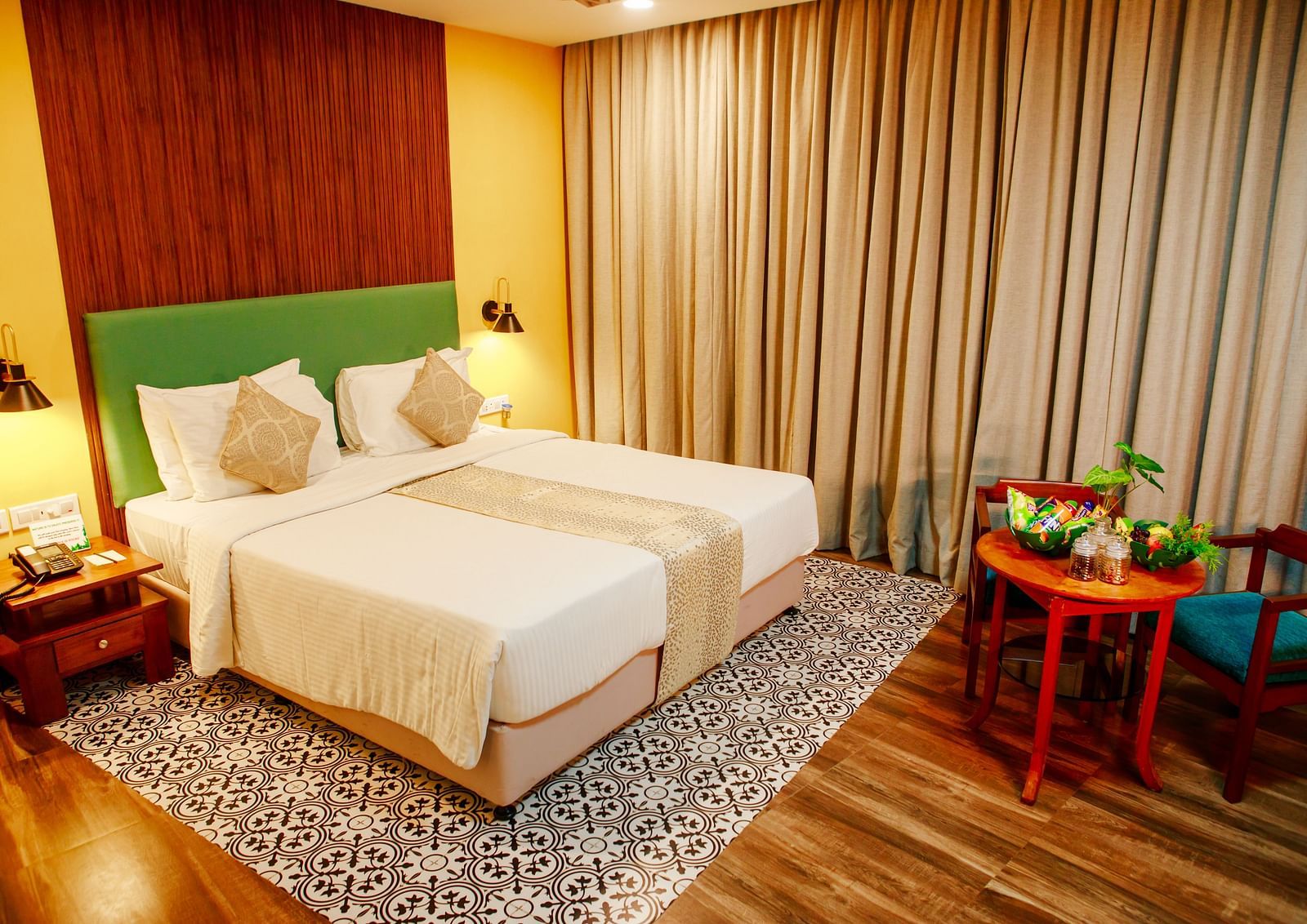 Valley View Room at GReaT Trails Yercaud By GRT Hotels - Room Stay in Yercaud that offers a double bed and a coffee table arrangement