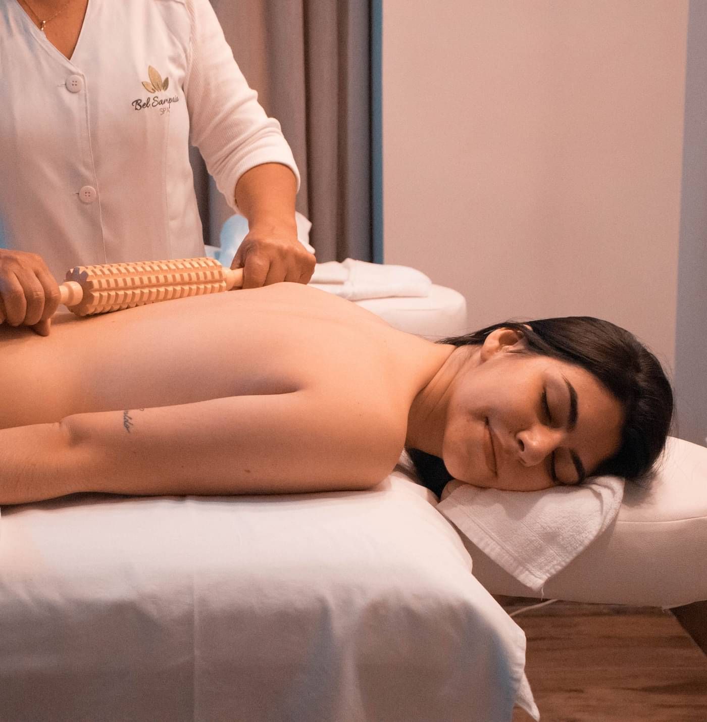 A person lying upside down on a spa bed and getting massaged | Summit Oakden Resort & Spa, Mall Road
