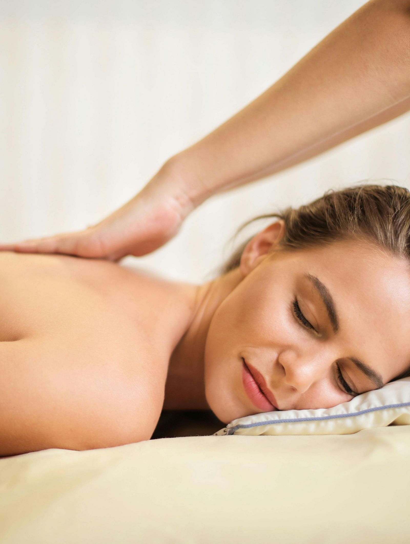 A person receiving a back massage.
