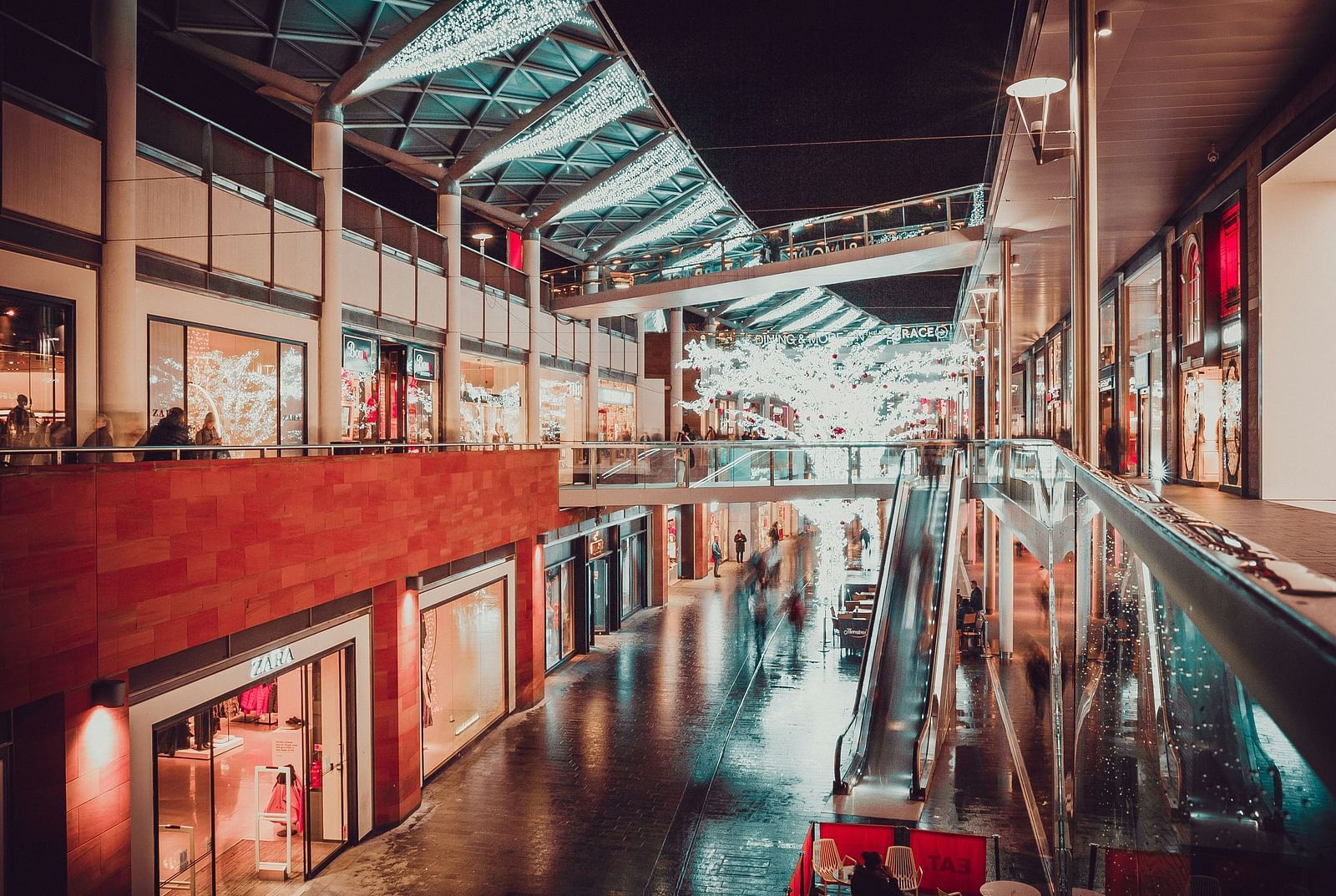  An interior view of the mall, illuminated by warm, ambient lighting