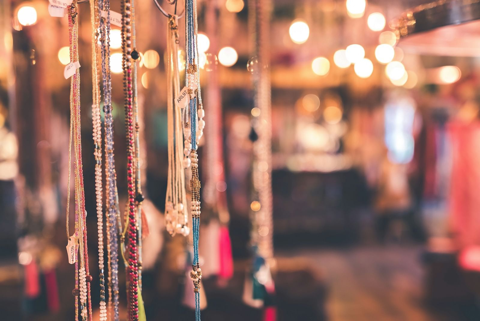 necklaces hanging in a street stall