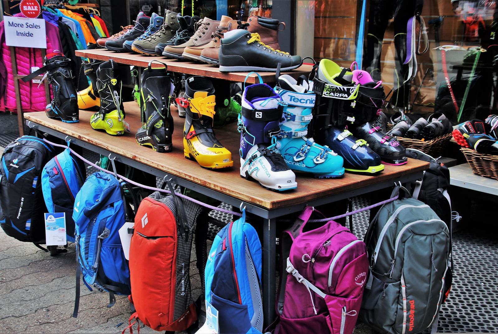 An overview of a street shop with many items kept on a table to be sold.