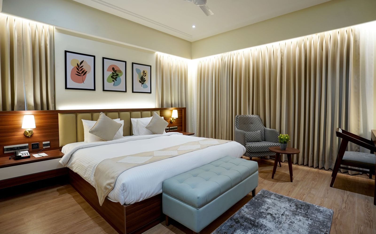 Full view of the Superior King Bed Room featuring a king size bed along with a cushioned bench in placed in front of it at M2 Square by Monday Premium.